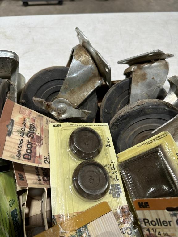 Box of misc roller casters,caster cups & door