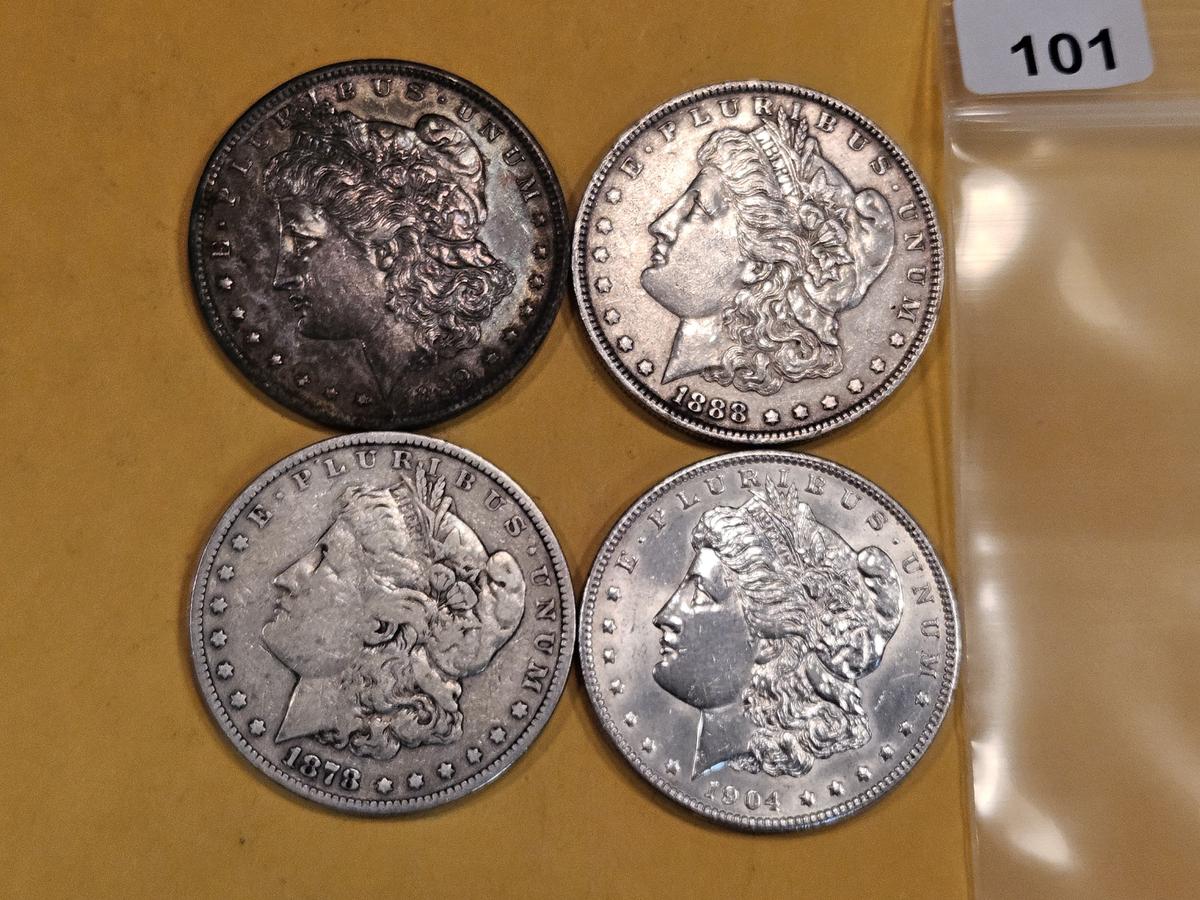 Four mixed Morgan Silver Dollars