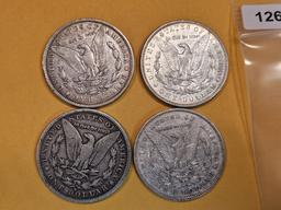 Four mixed Morgan Silver Dollars