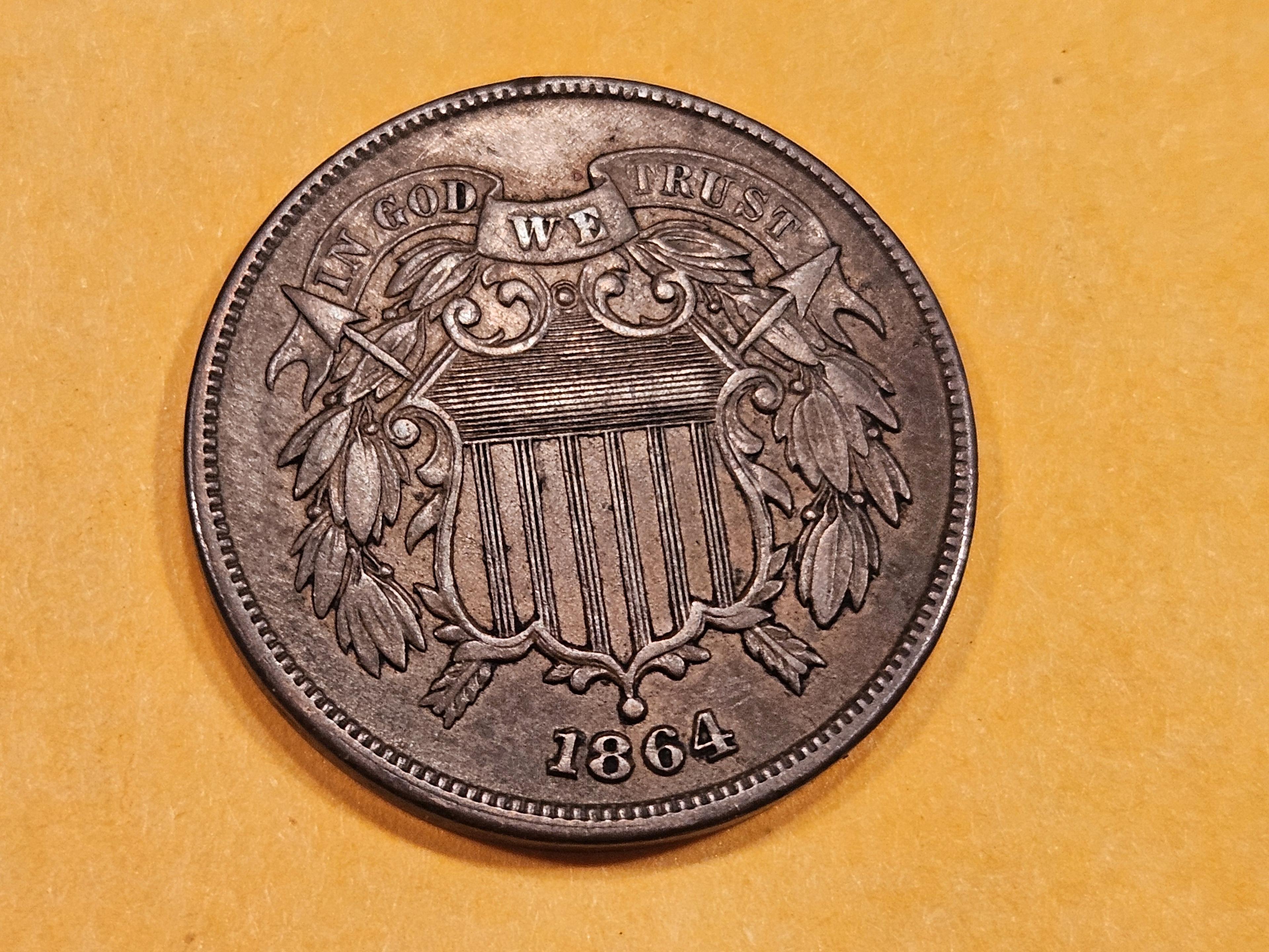 1864 Two Cent piece in About Uncirculated Plus