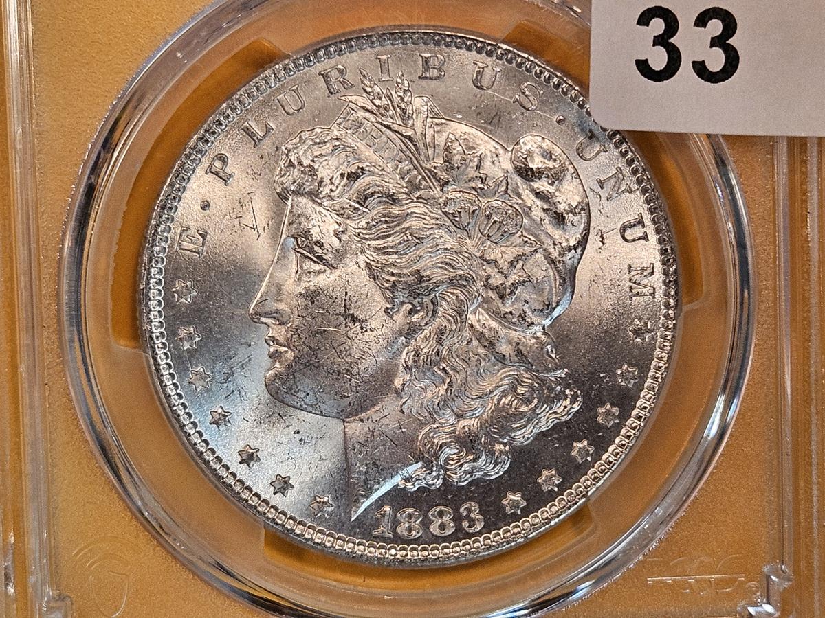 PCGS 1883 Morgan Dollar in Mint State 64