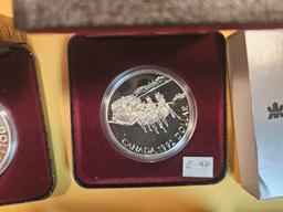 Four Canadian Proof or prooflike Silver Dollars