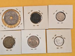 Six mixed World Coins