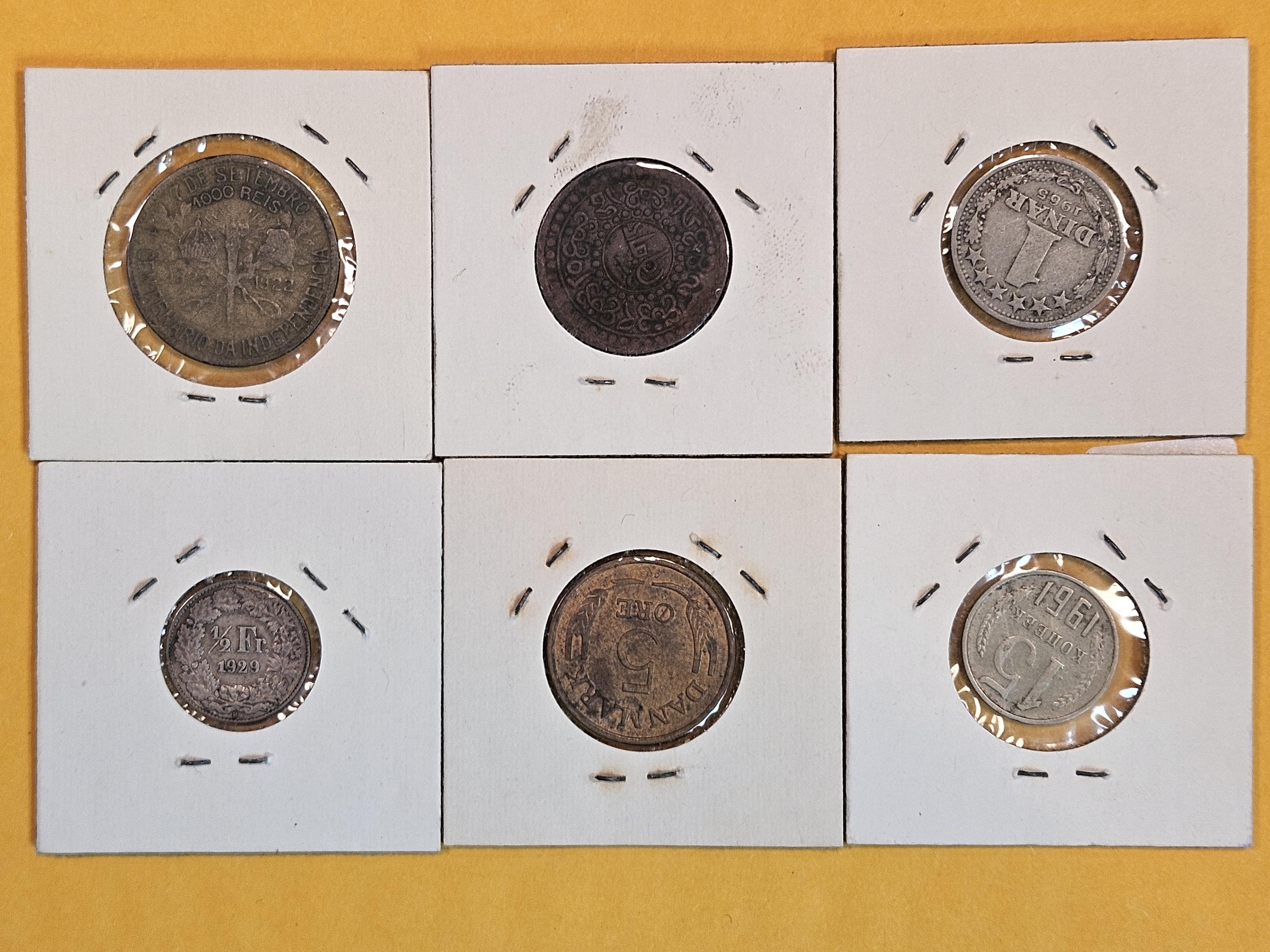 Six mixed World Coins