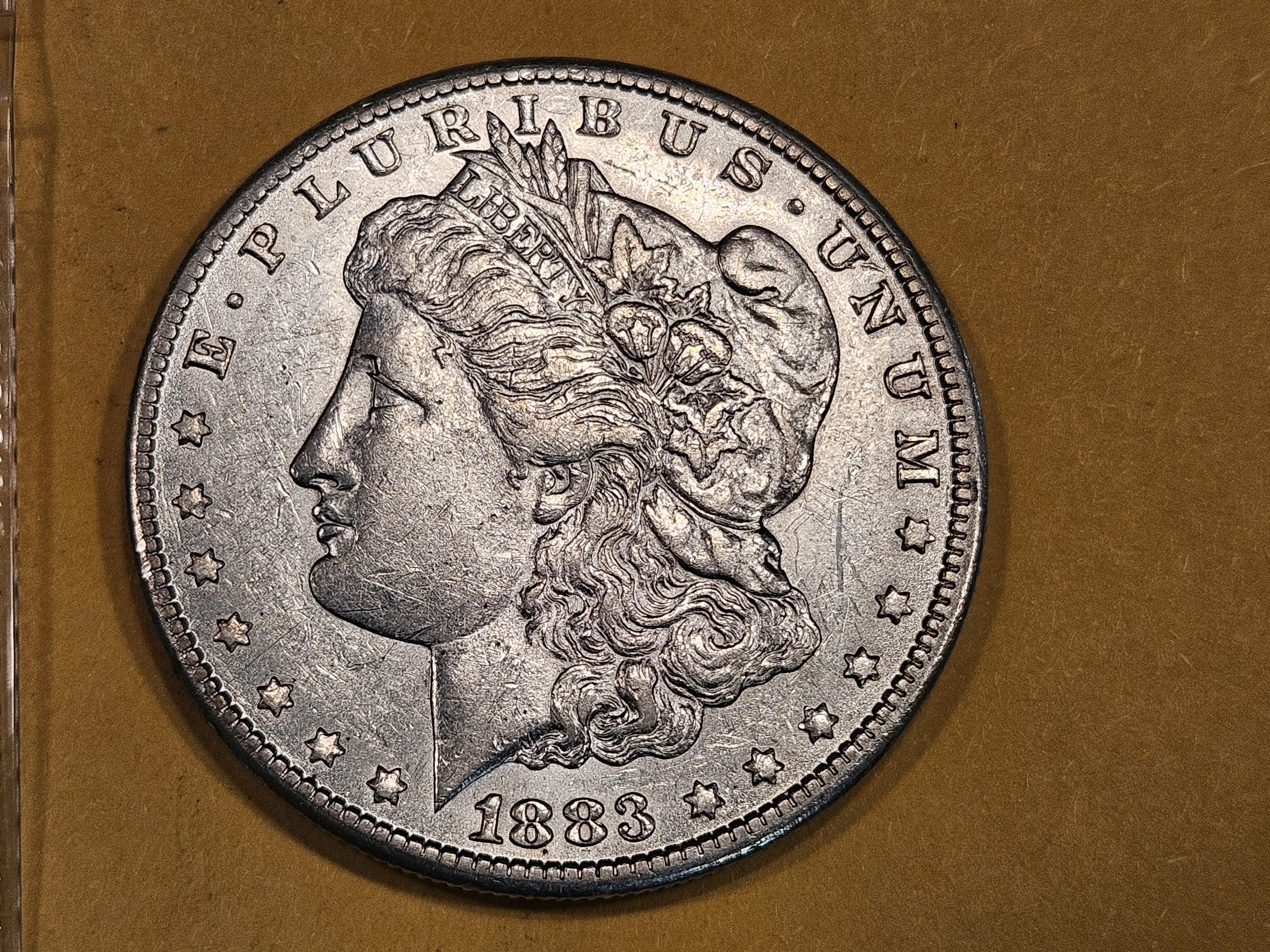 ** KEY DATE ** 1883-CC Morgan Dollar in Brilliant About uncirculated plus