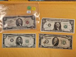 Four mixed pieces of US currency