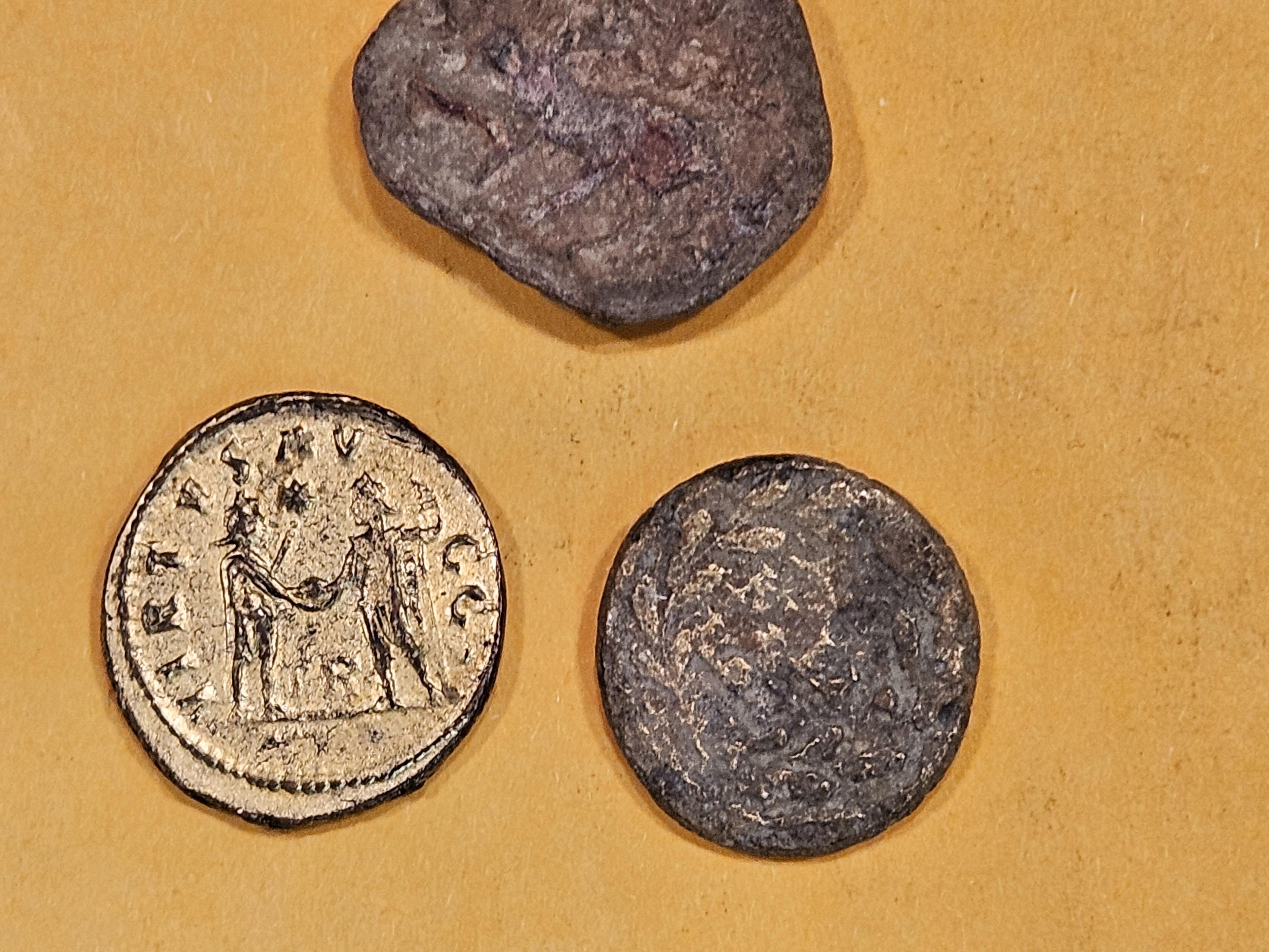 Three Ancient-y looking coins