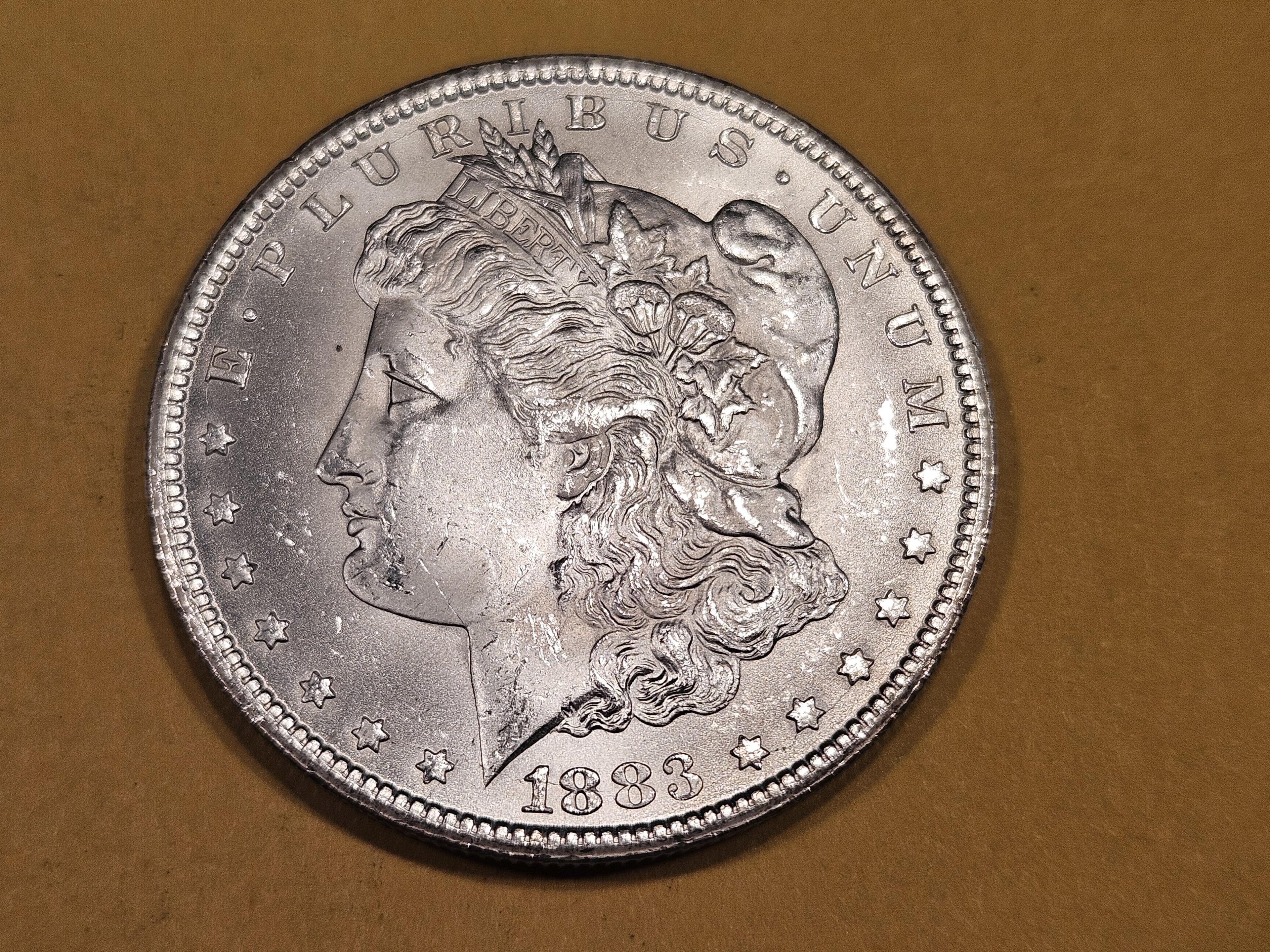 ** KEY DATE ** 1883-CC Morgan Dollar in Very Choice Brilliant Uncirculated plus