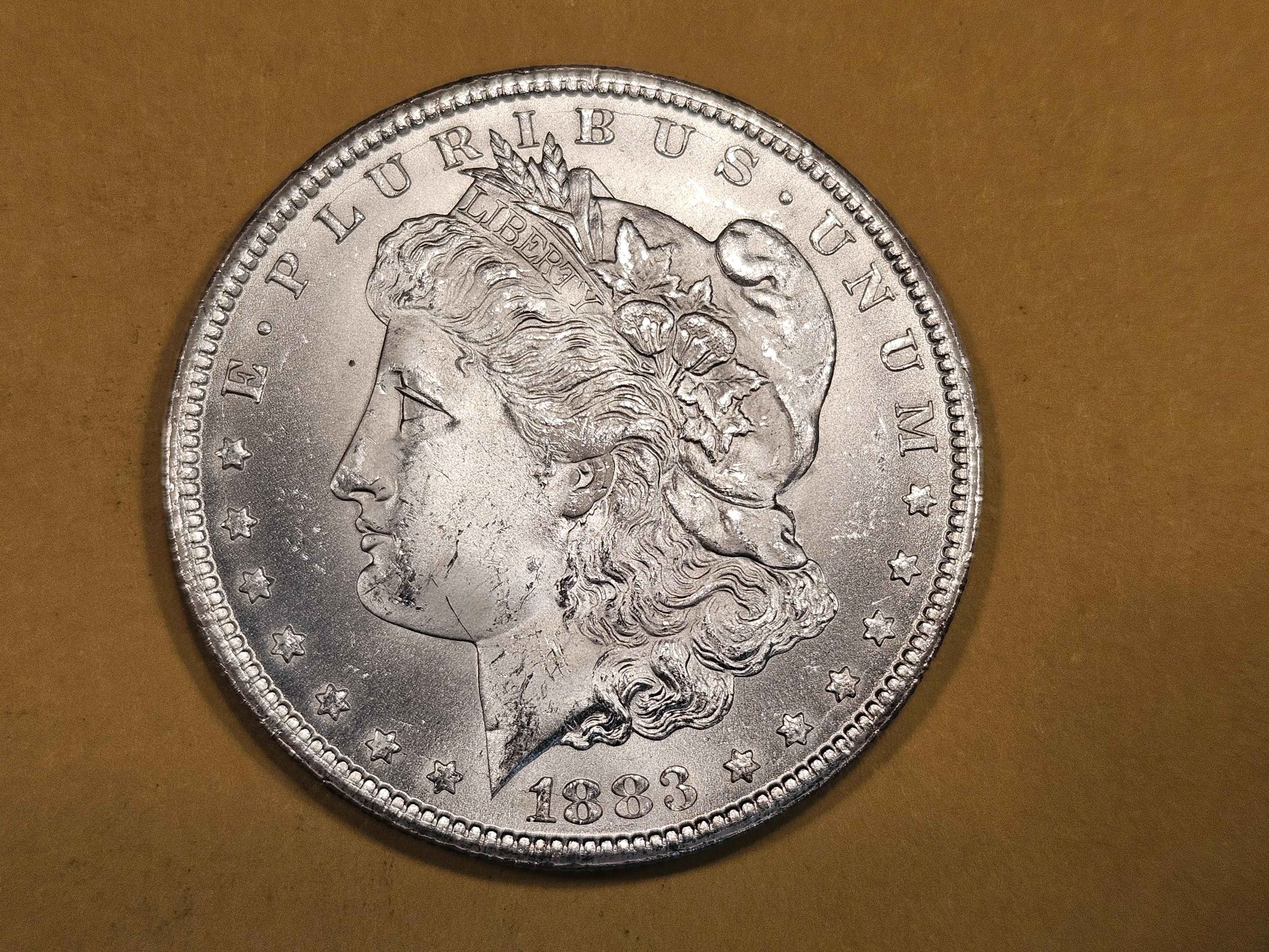 ** KEY DATE ** 1883-CC Morgan Dollar in Very Choice Brilliant Uncirculated plus