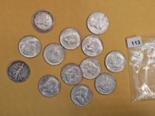 Thirteen Mixed Silver Half Dollars