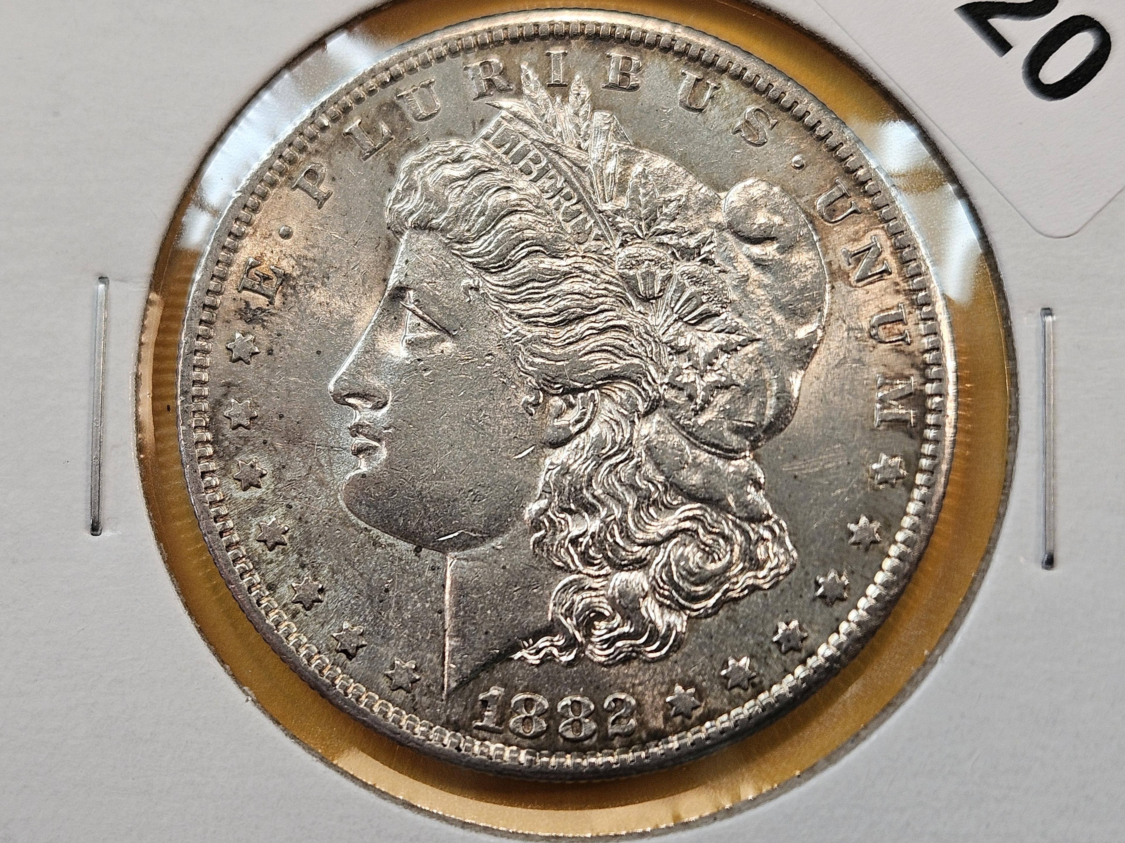 Two About Uncirculated Morgan Silver Dollars