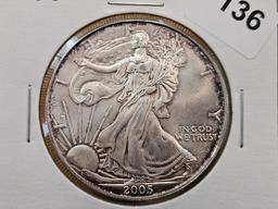 Four Uncirculated American Silver Eagles with Light Toning