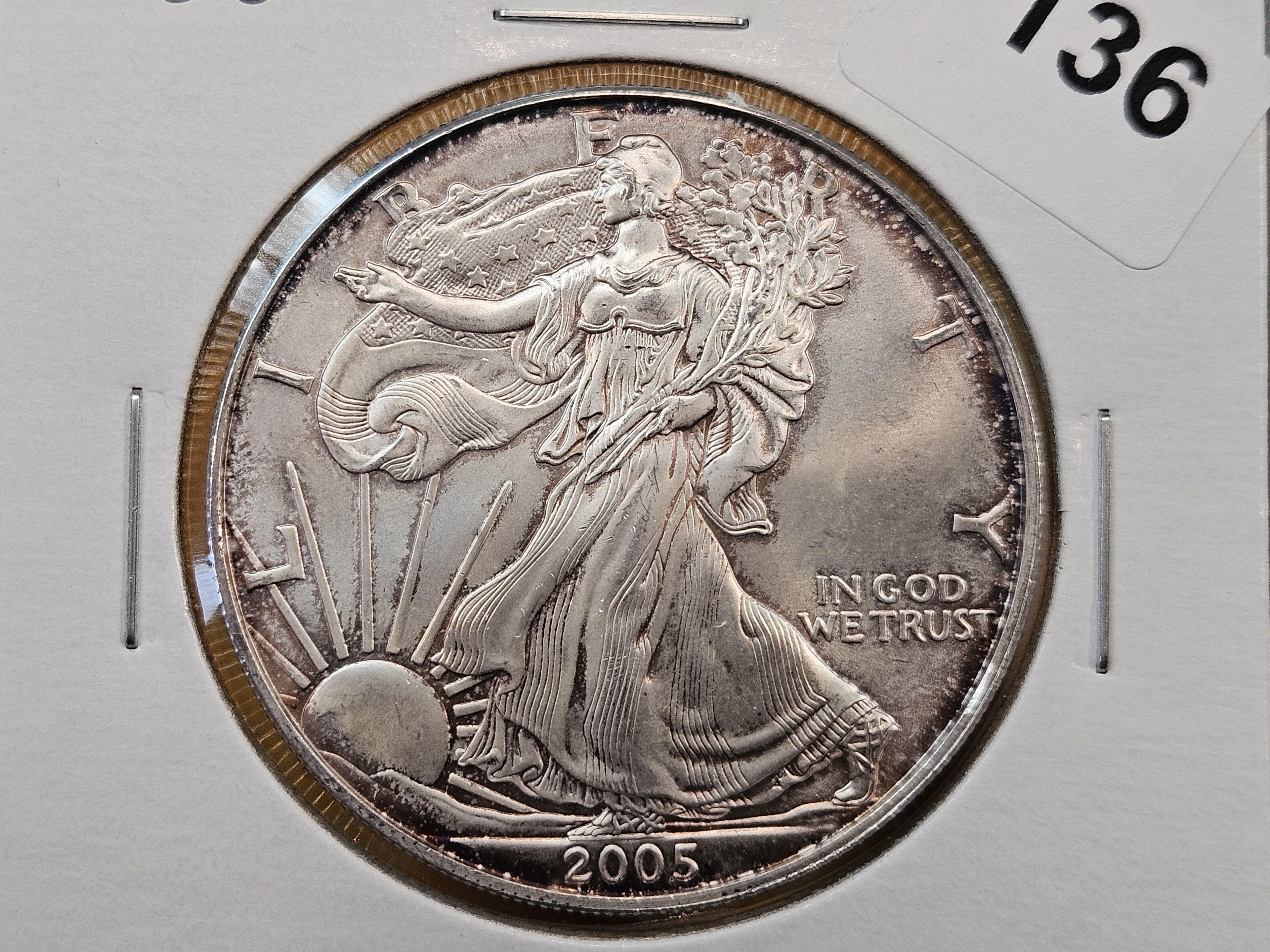 Four Uncirculated American Silver Eagles with Light Toning