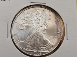 Four Uncirculated American Silver Eagles with Light Toning