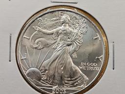 Four Uncirculated American Silver Eagles with Light Toning