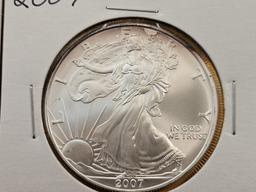 Four Uncirculated American Silver Eagles with Light Toning