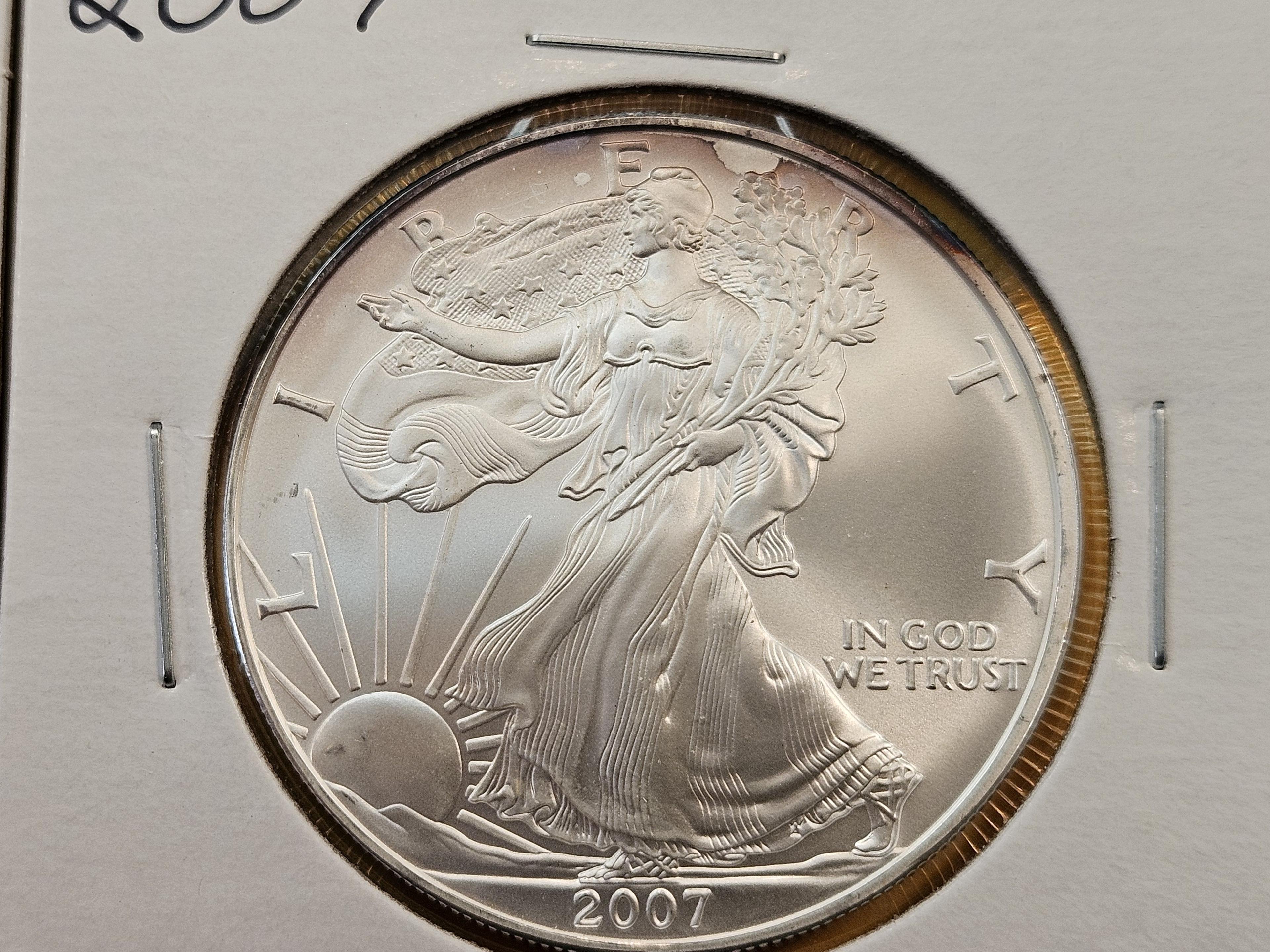 Four Uncirculated American Silver Eagles with Light Toning