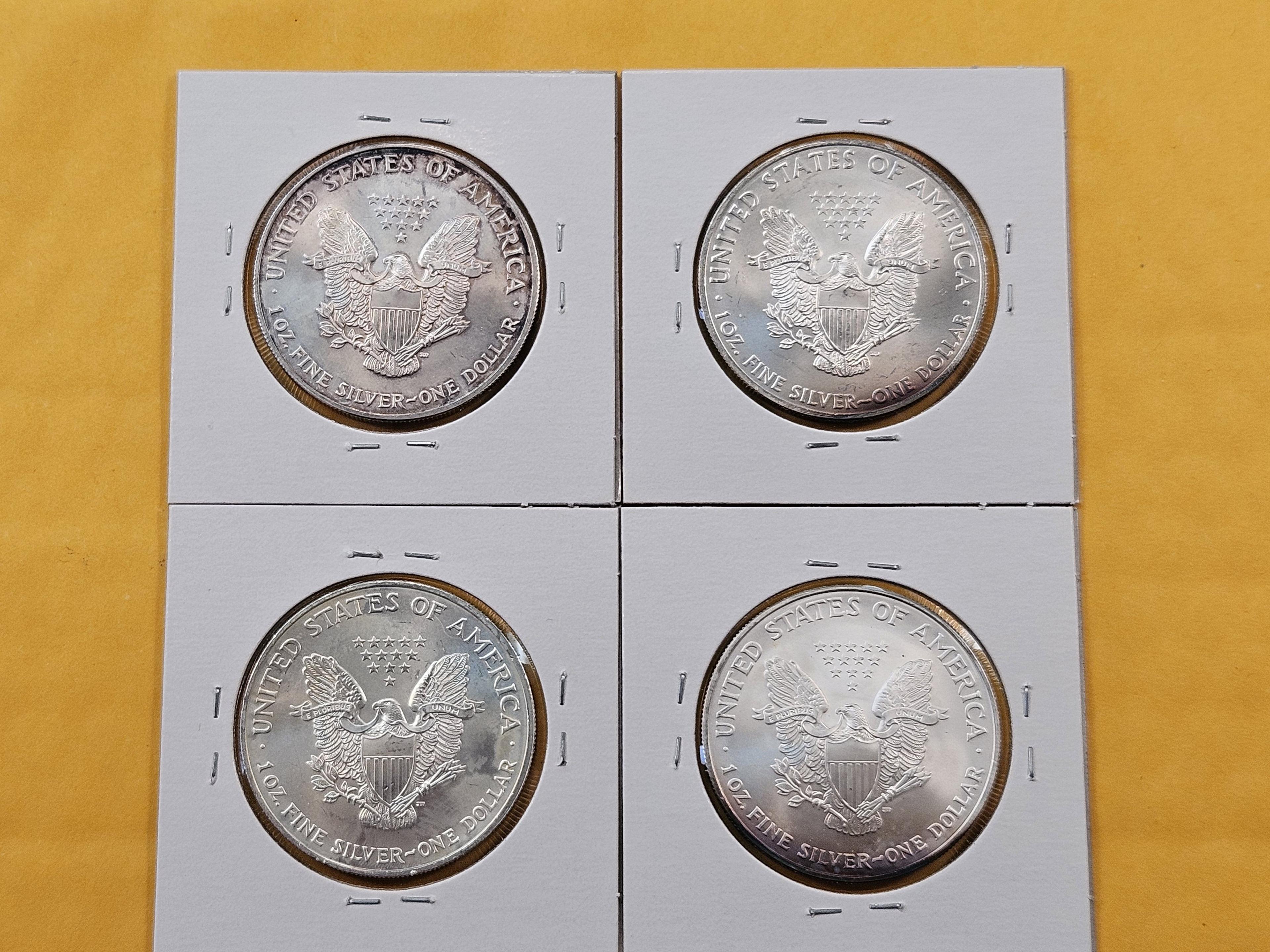 Four Uncirculated American Silver Eagles with Light Toning