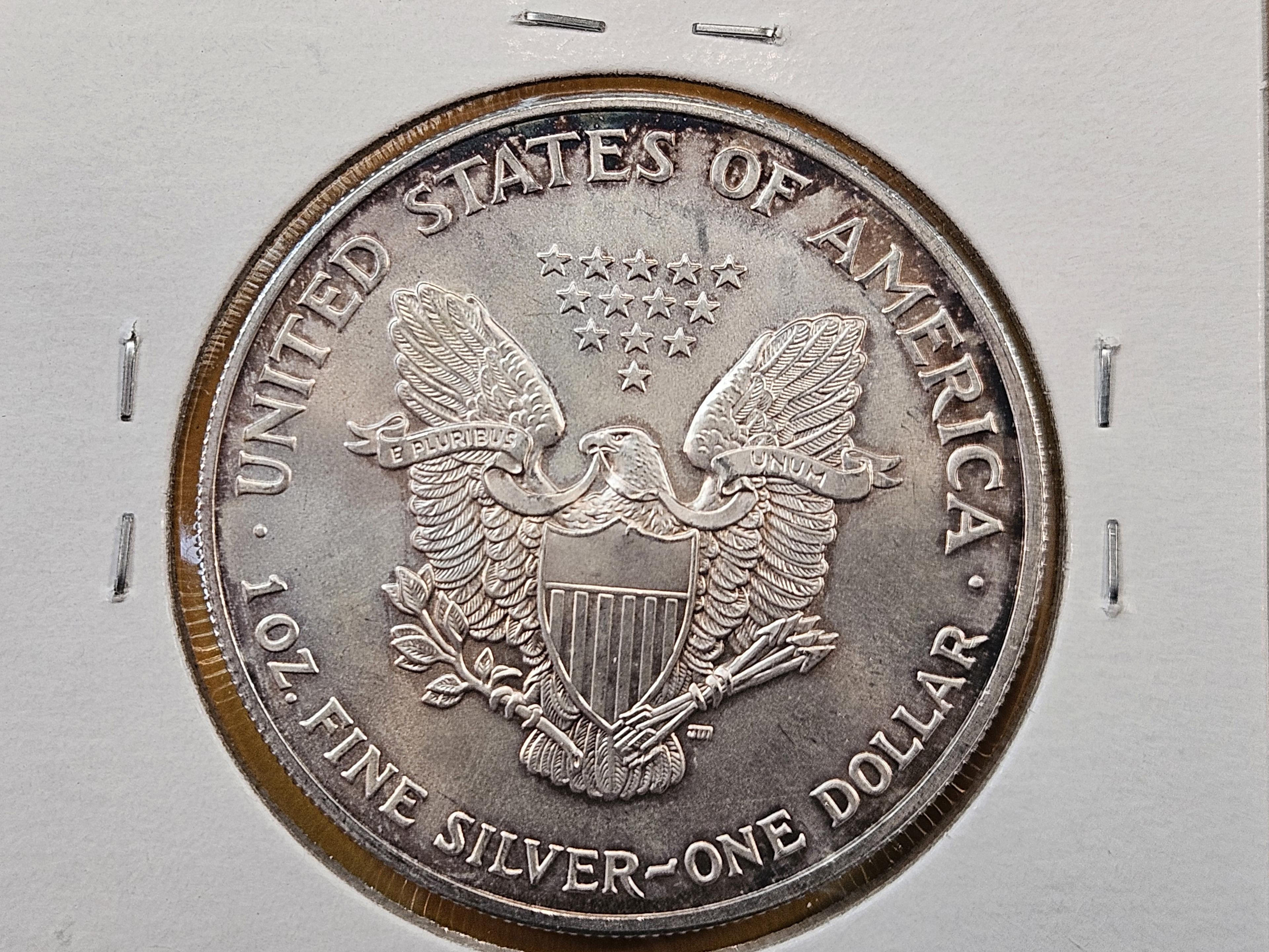 Four Uncirculated American Silver Eagles with Light Toning