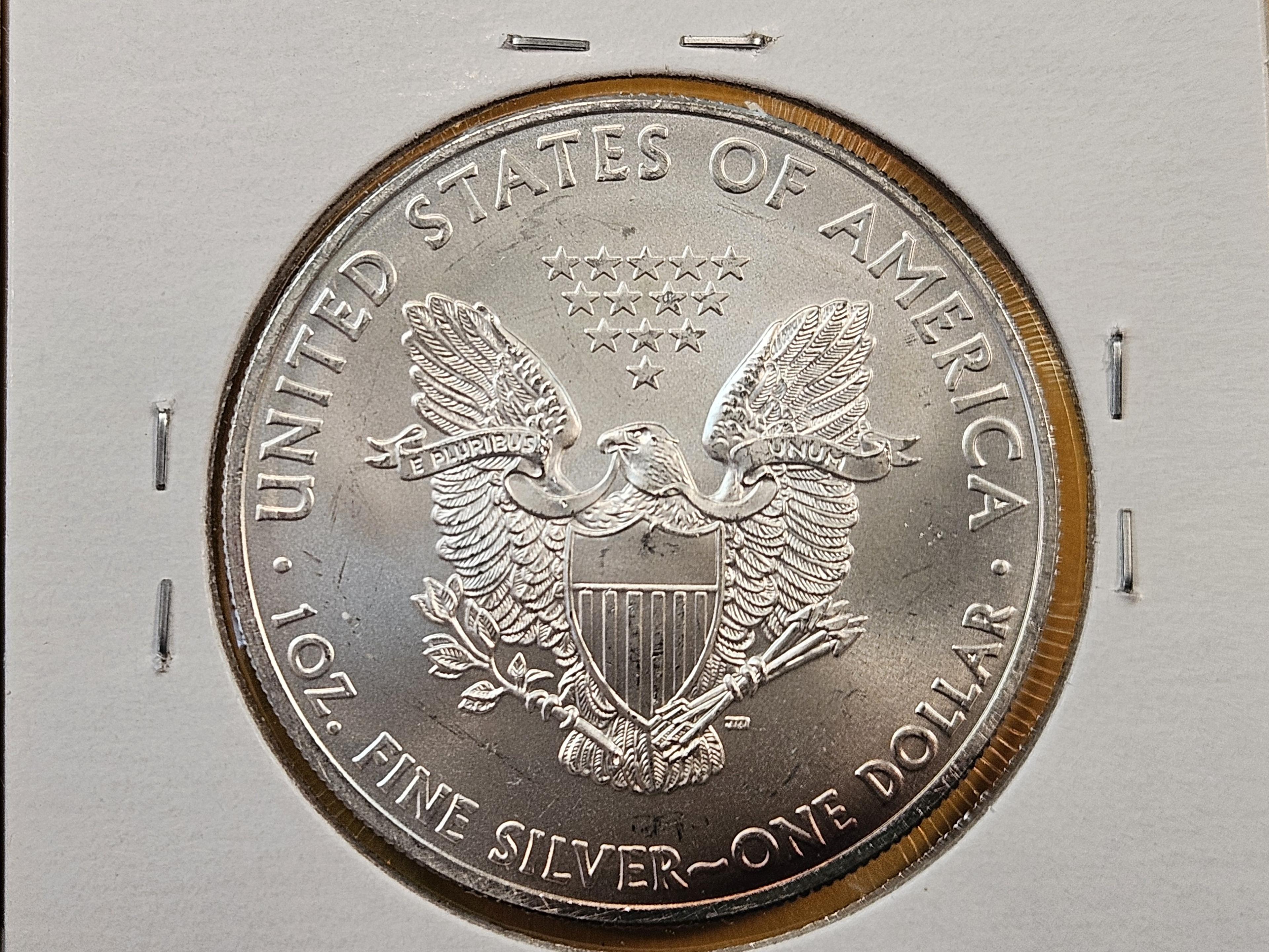 Four Uncirculated American Silver Eagles with Light Toning