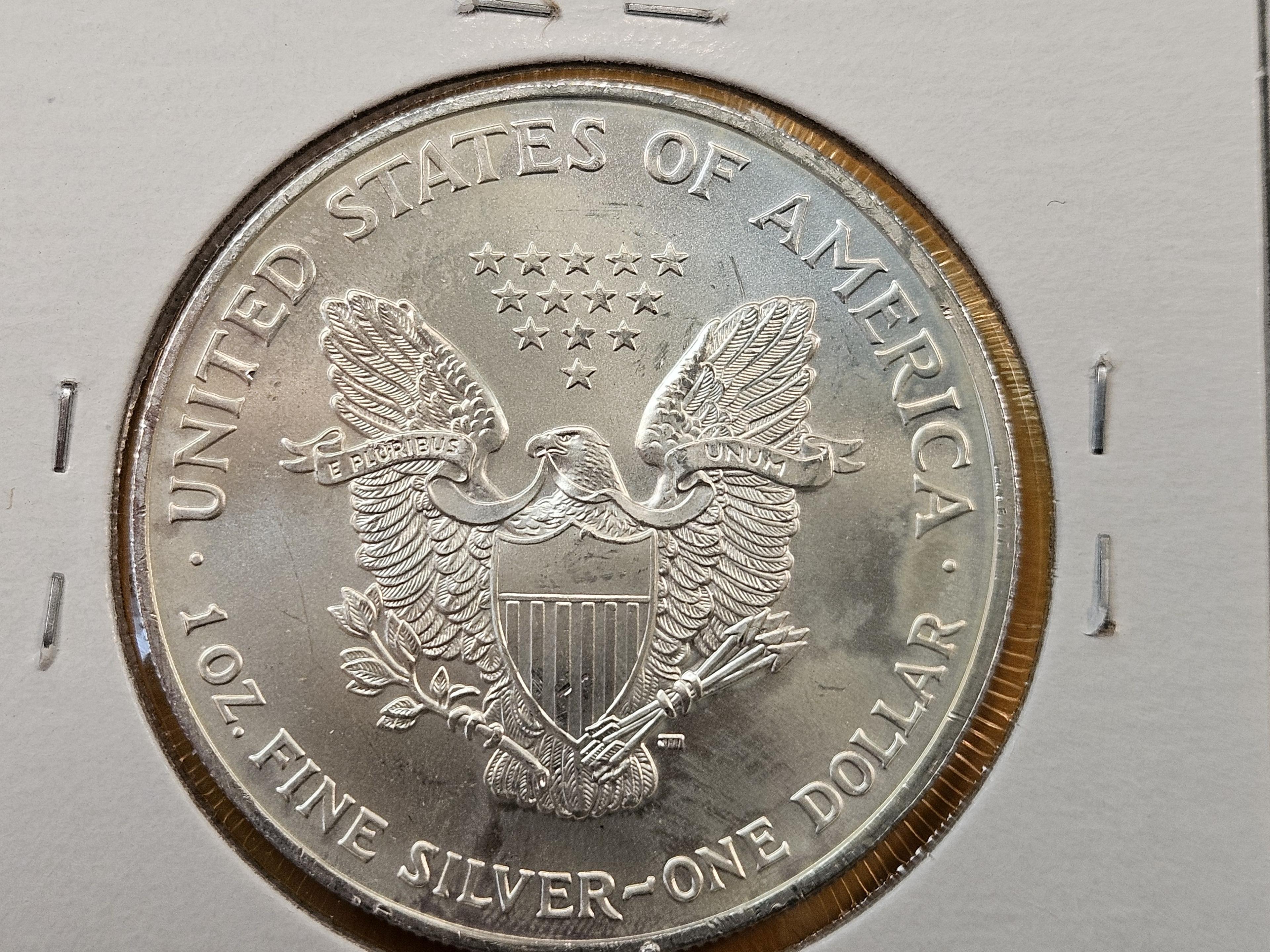 Four Uncirculated American Silver Eagles with Light Toning