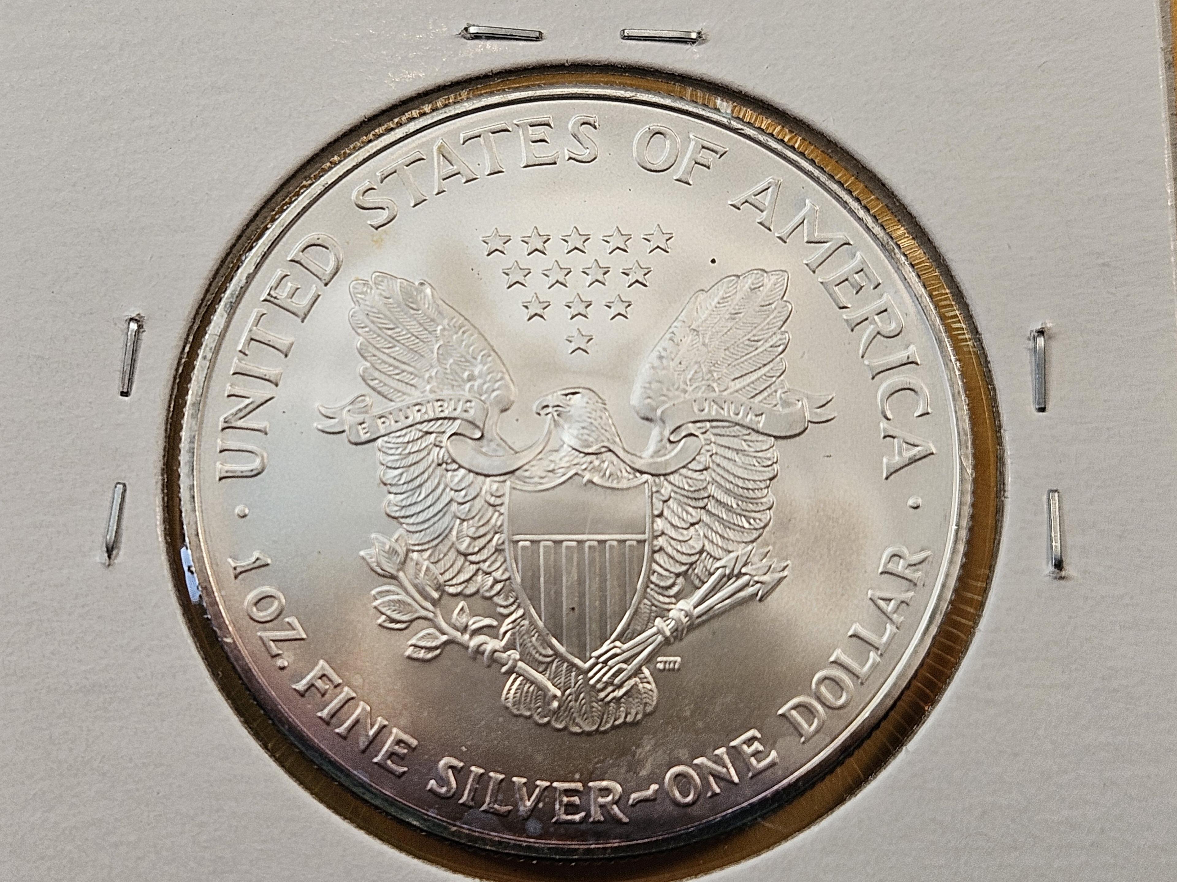 Four Uncirculated American Silver Eagles with Light Toning