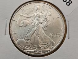 Four GEM Brilliant Uncirculated American Silver Eagles