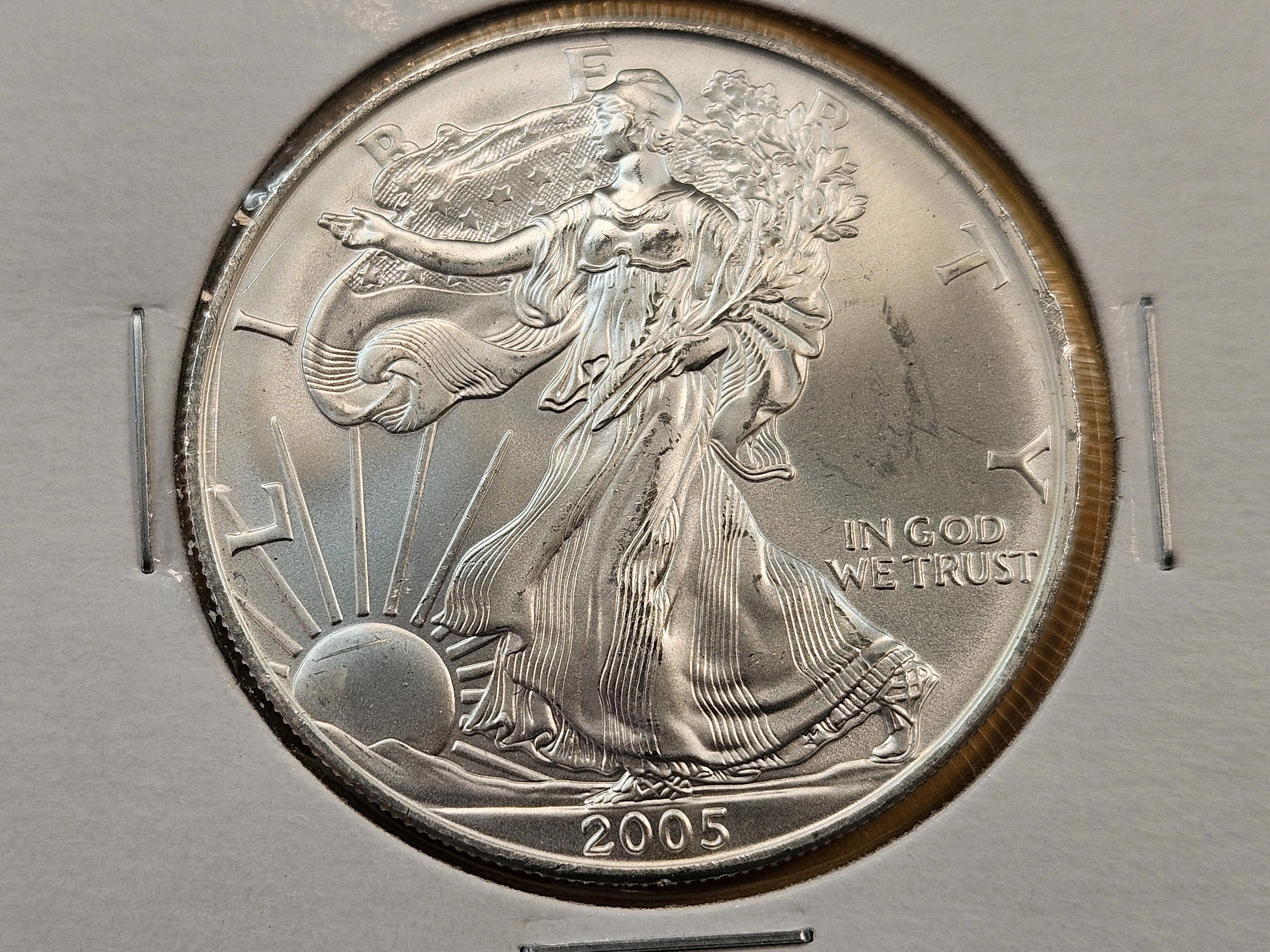 Four GEM Brilliant Uncirculated American Silver Eagles