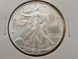Four GEM Brilliant Uncirculated American Silver Eagles