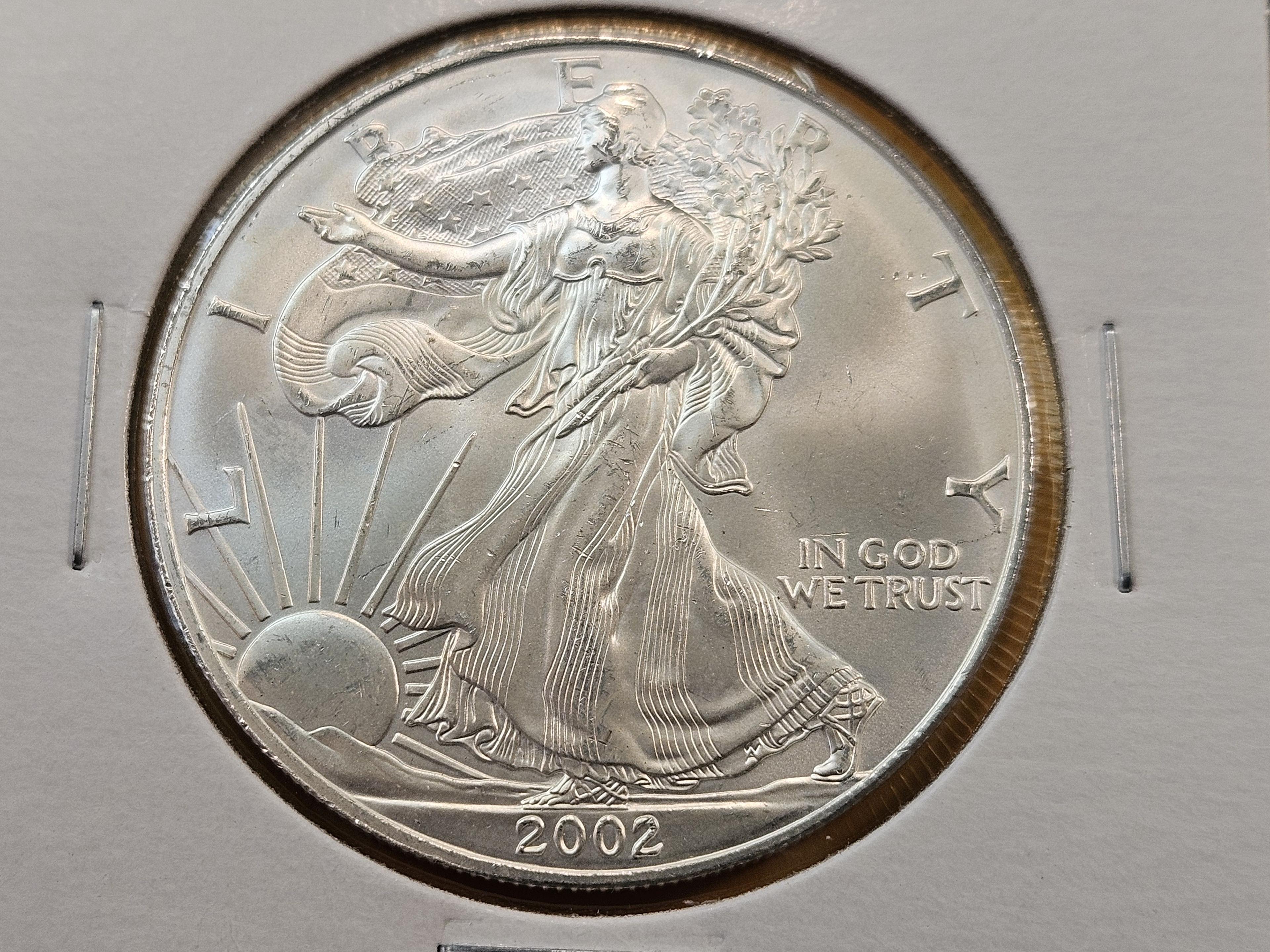 Four GEM Brilliant Uncirculated American Silver Eagles