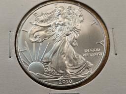 Four GEM Brilliant Uncirculated American Silver Eagles