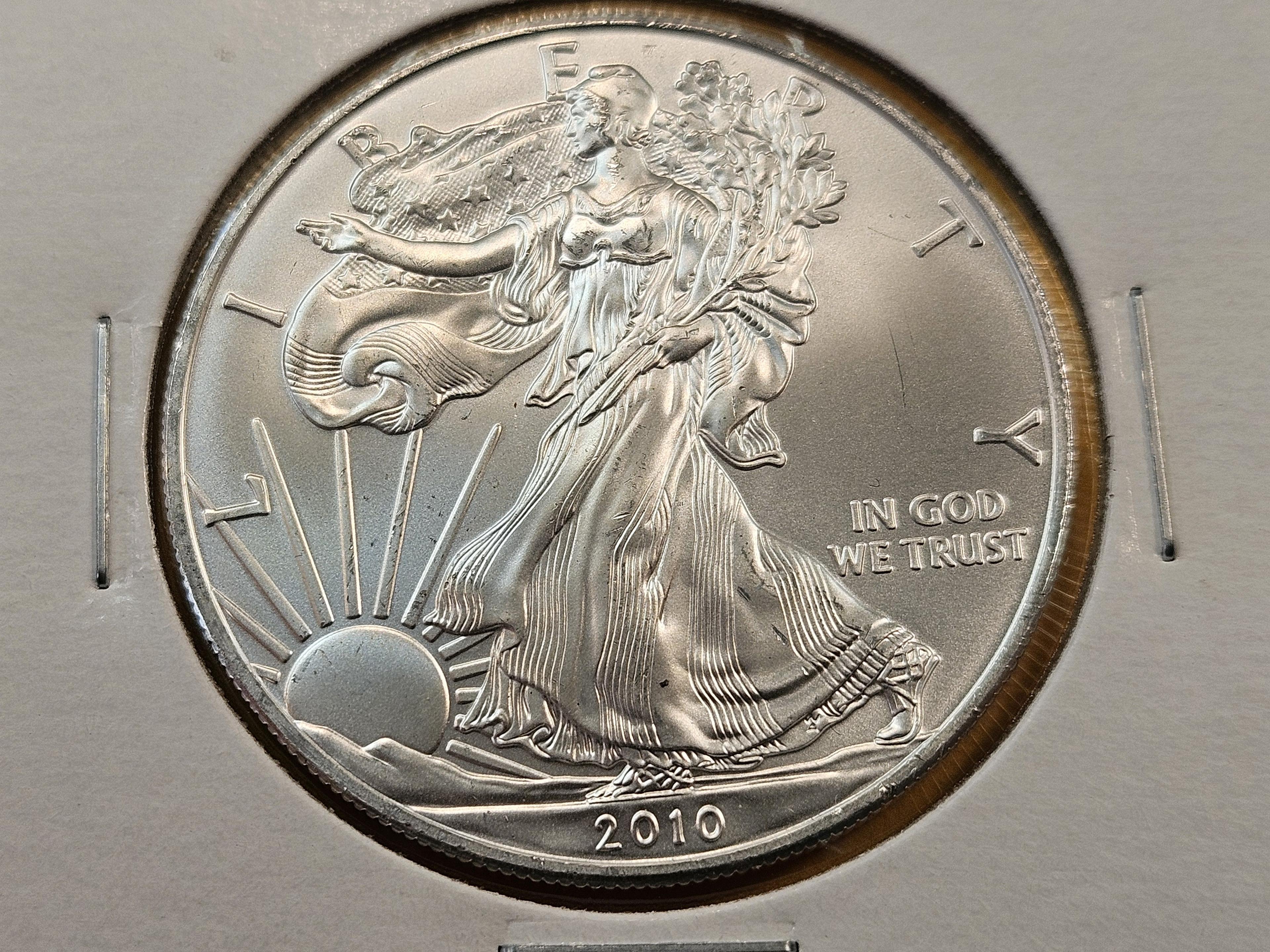 Four GEM Brilliant Uncirculated American Silver Eagles