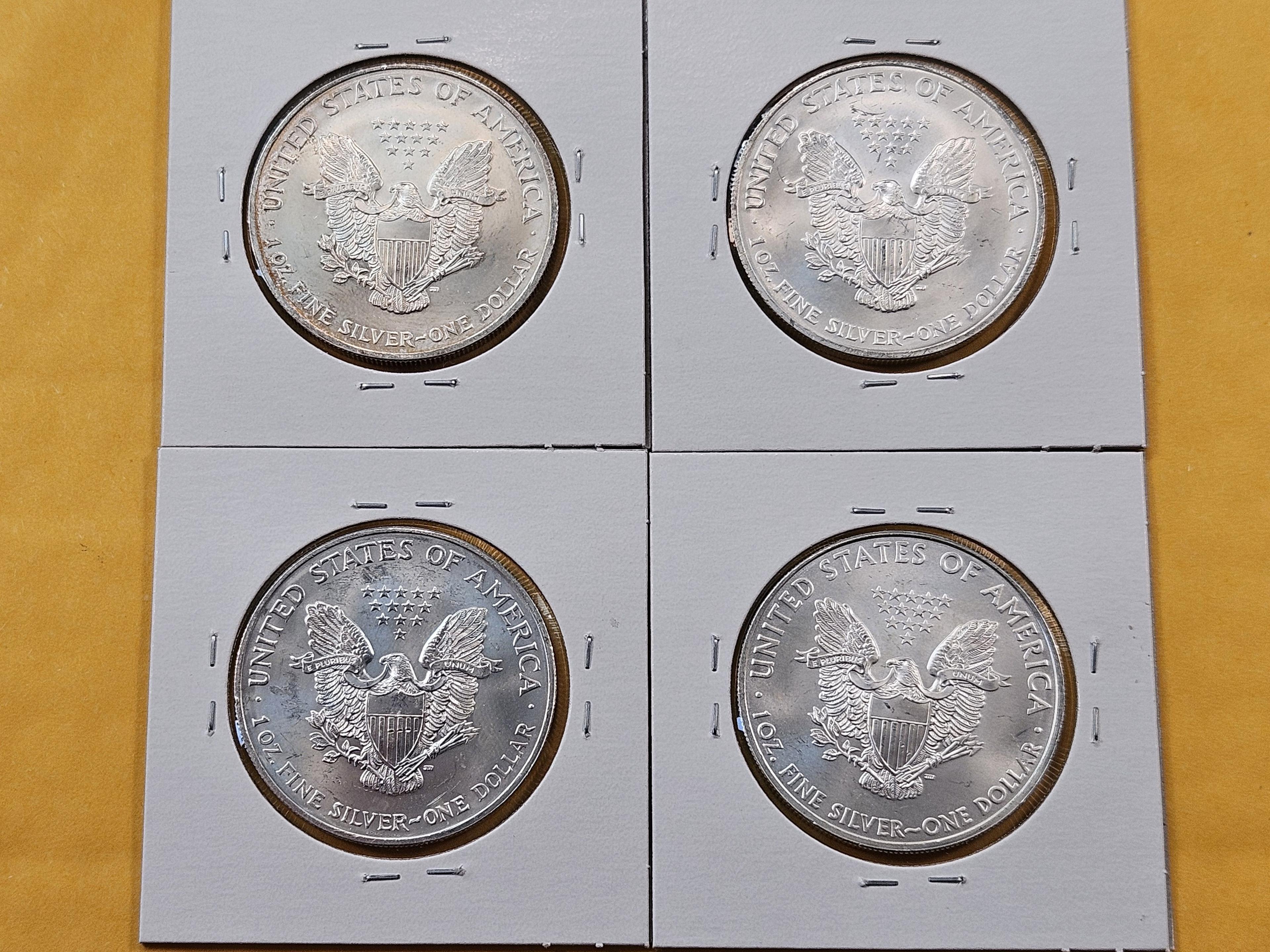 Four GEM Brilliant Uncirculated American Silver Eagles