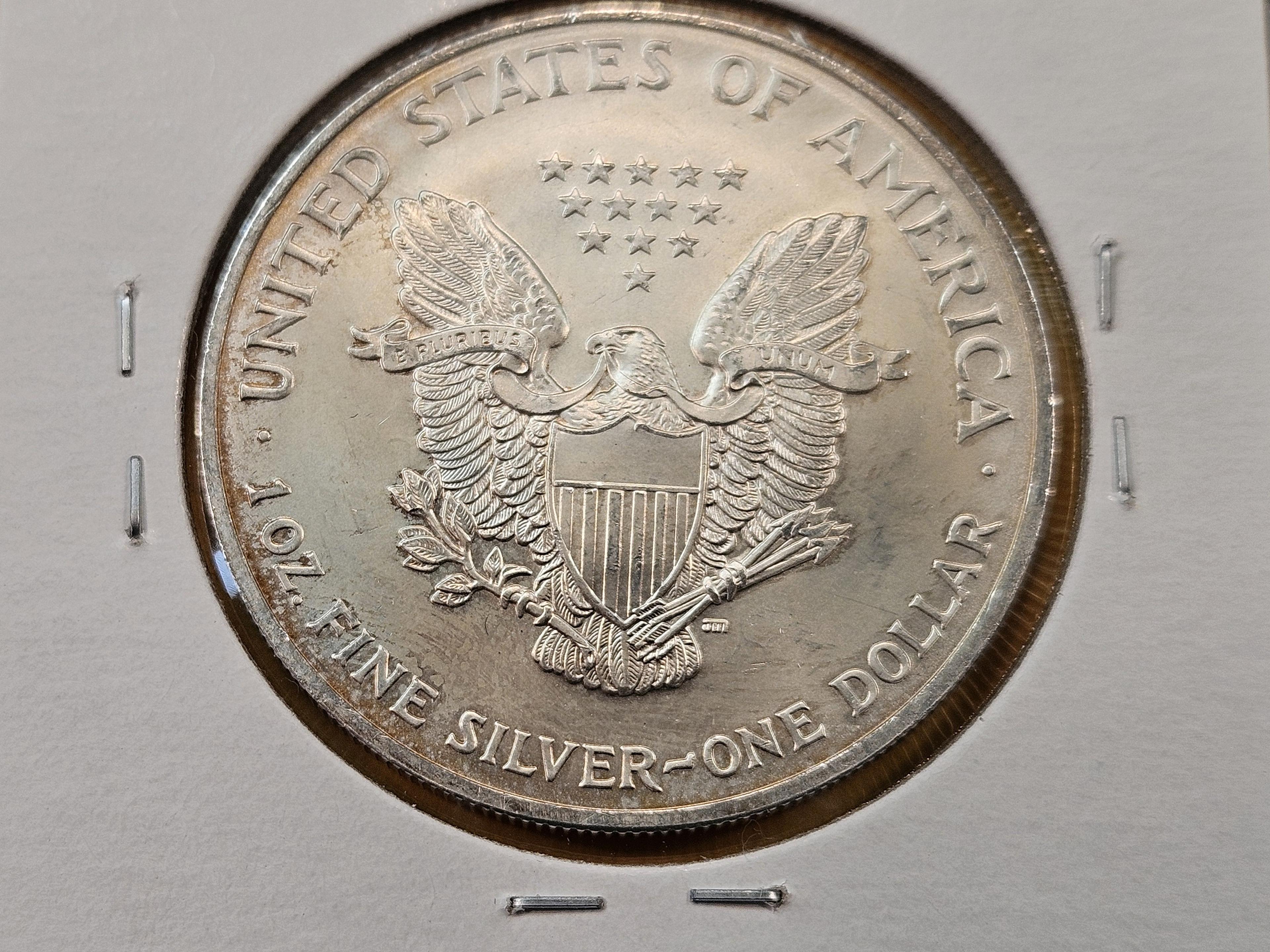 Four GEM Brilliant Uncirculated American Silver Eagles