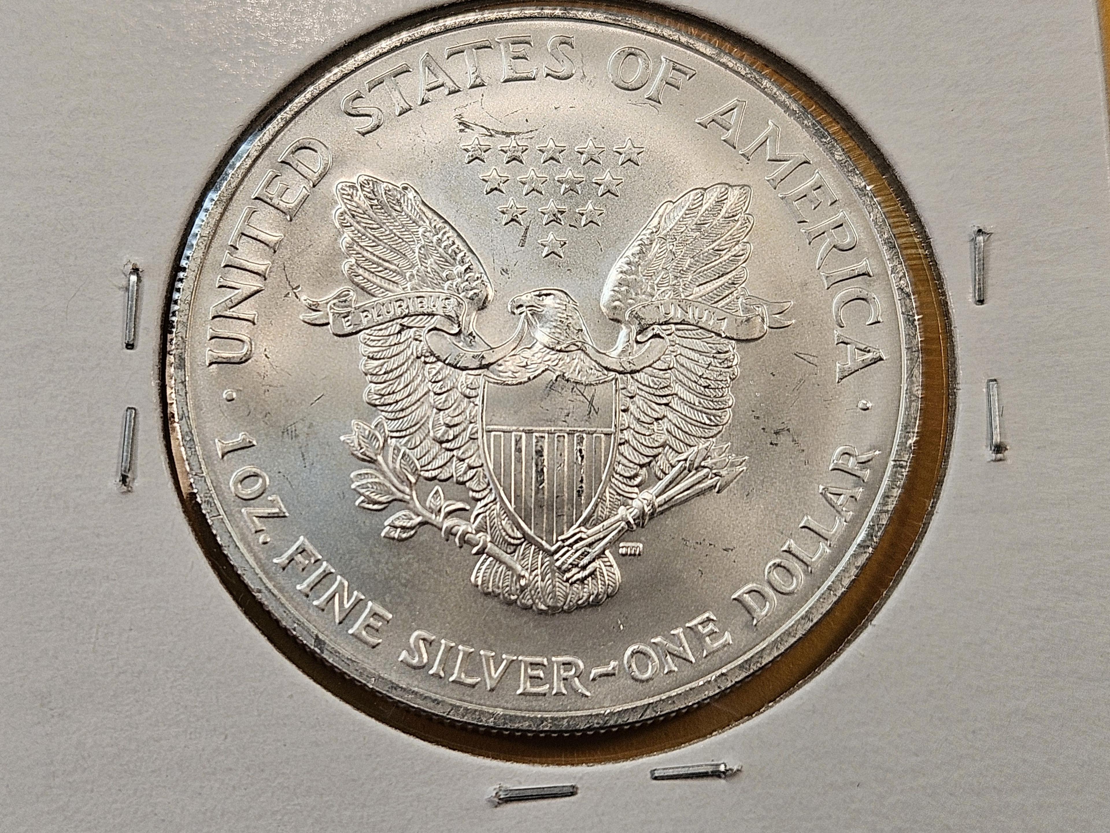 Four GEM Brilliant Uncirculated American Silver Eagles