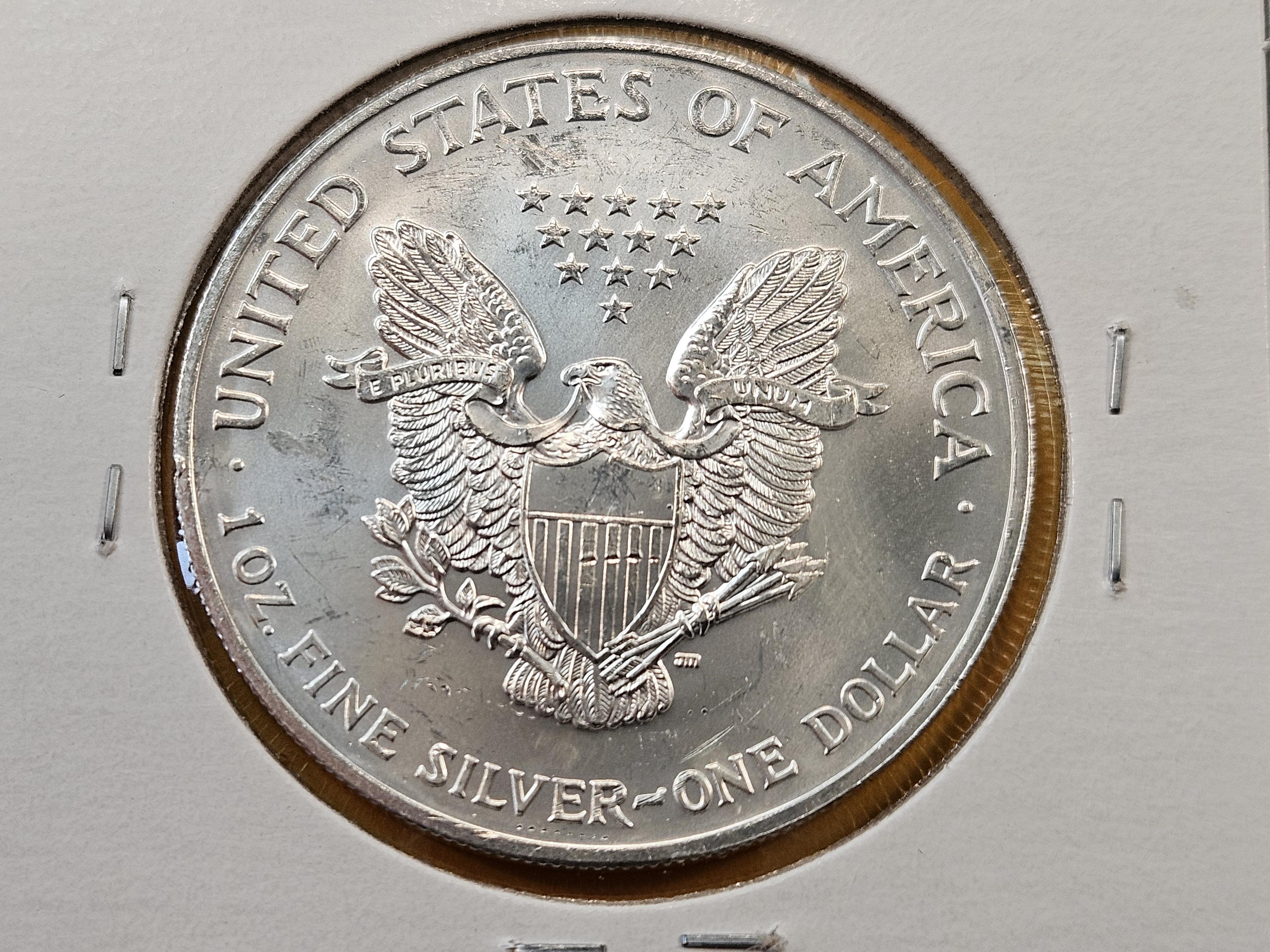 Four GEM Brilliant Uncirculated American Silver Eagles