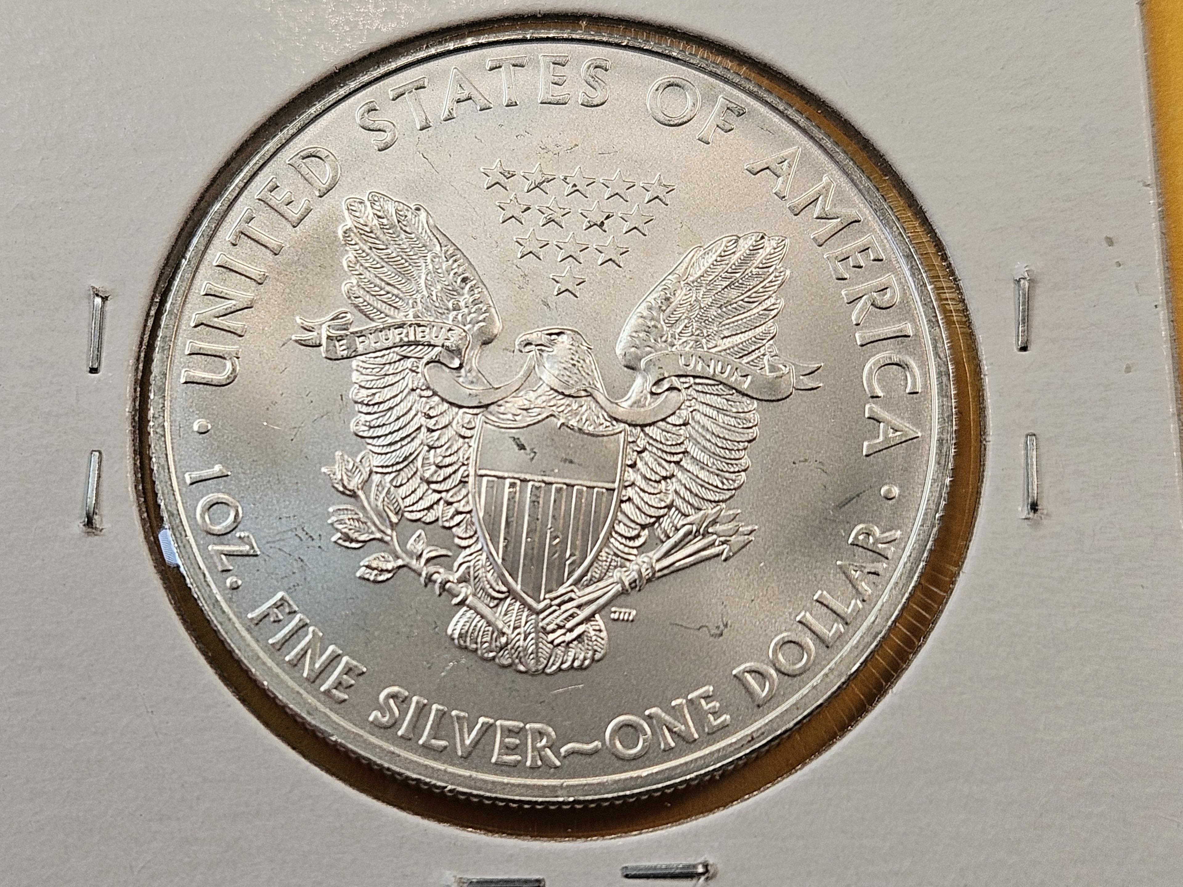 Four GEM Brilliant Uncirculated American Silver Eagles