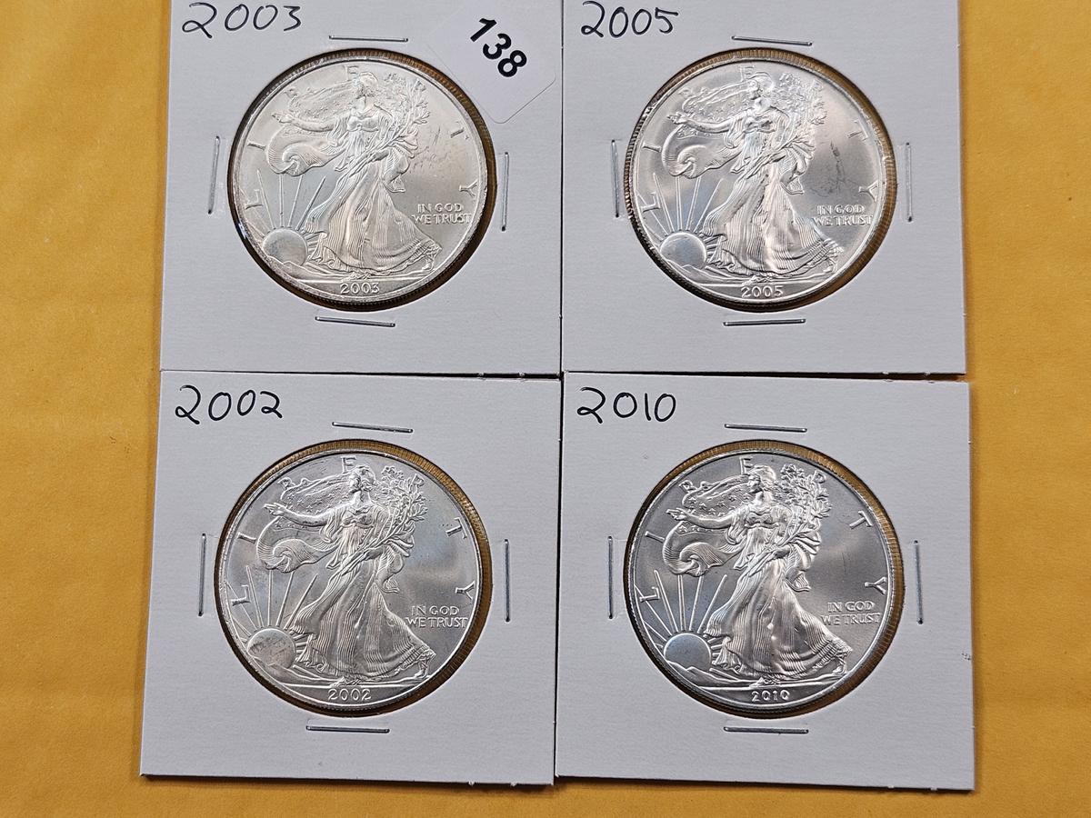 Four GEM Brilliant Uncirculated American Silver Eagles
