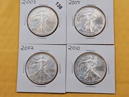 Four GEM Brilliant Uncirculated American Silver Eagles