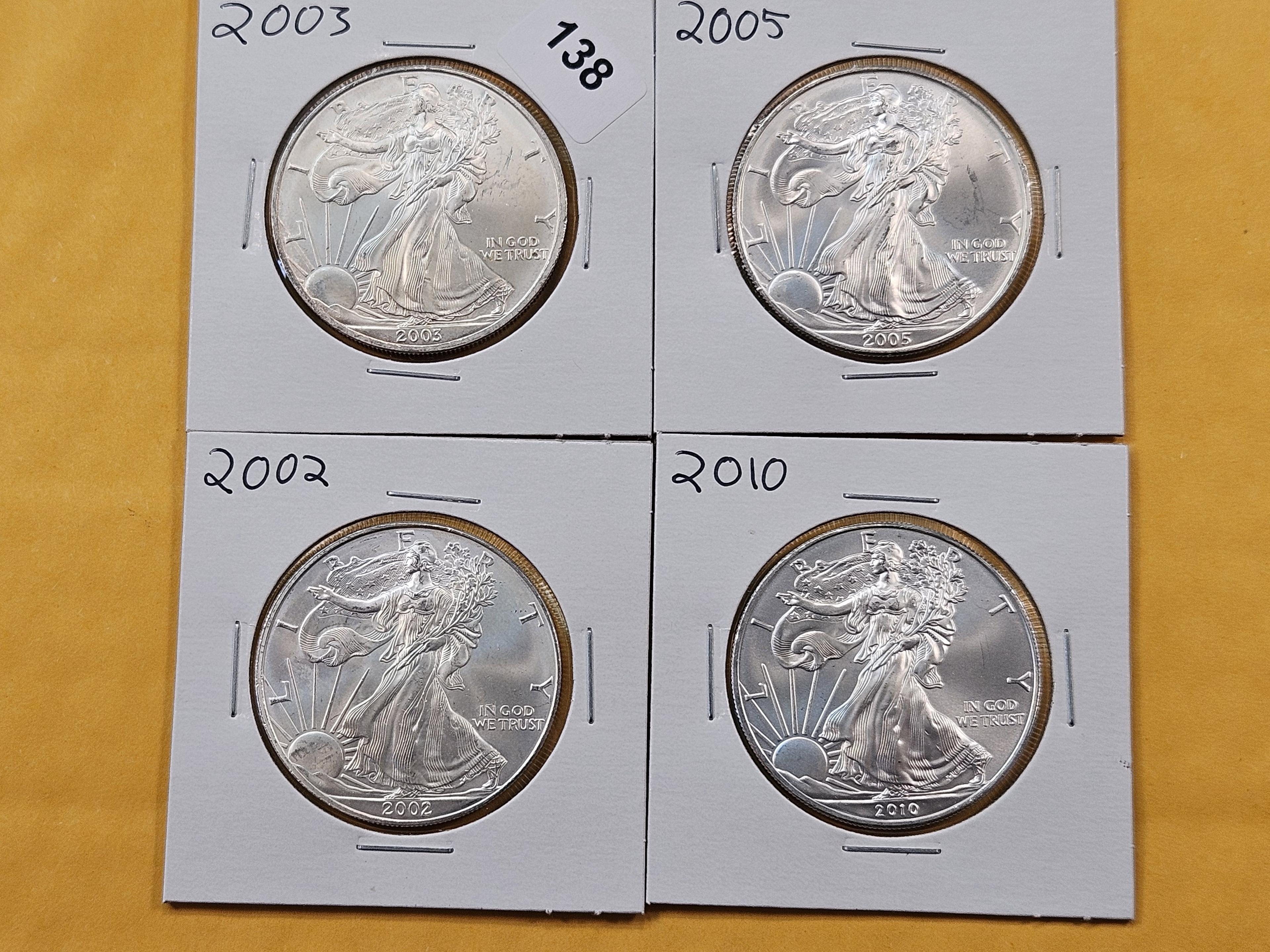 Four GEM Brilliant Uncirculated American Silver Eagles