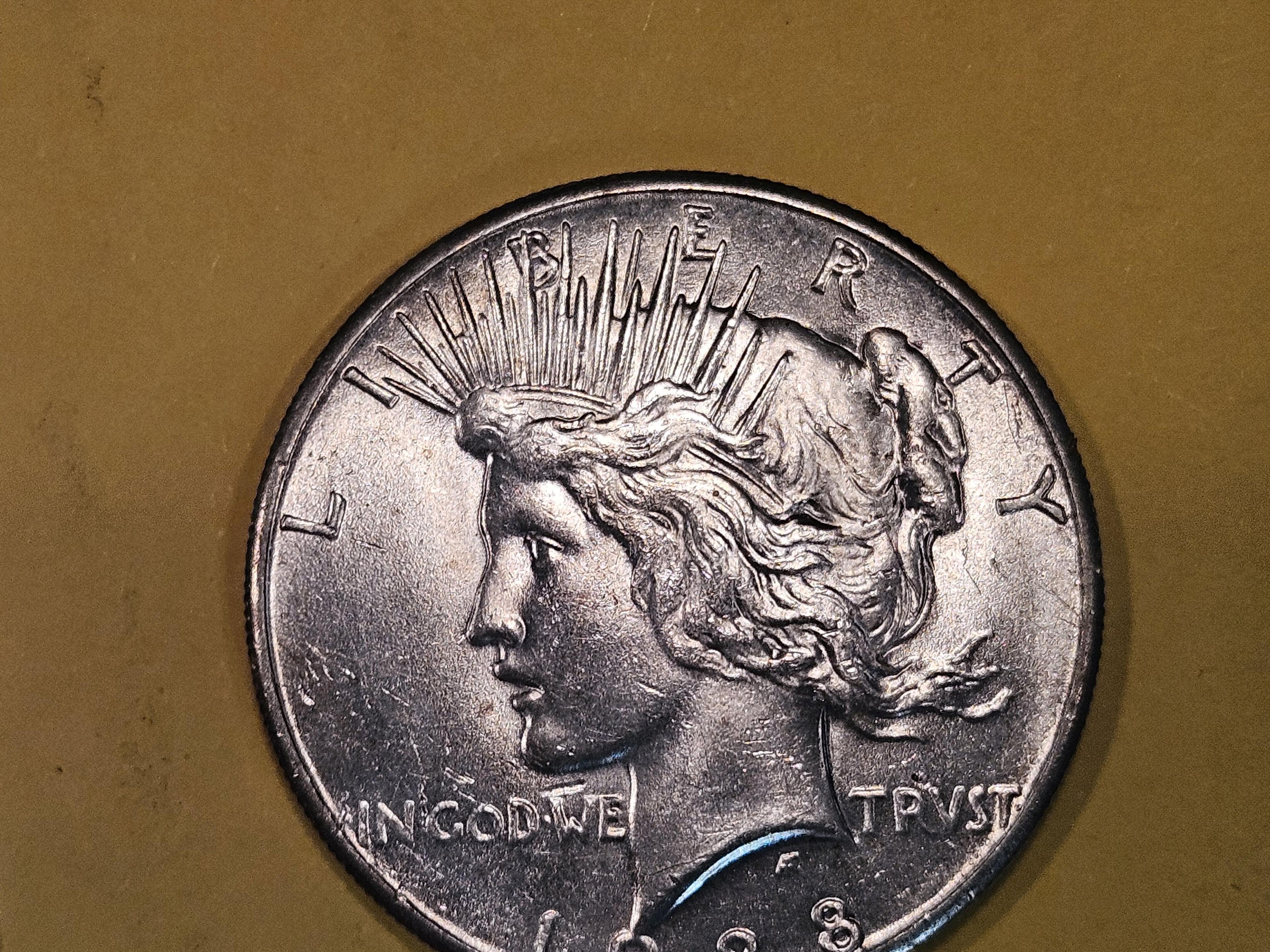** KEY DATE ** 1928 Peace Dollar in Brilliant About Uncirculated - 58!