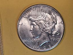 ** KEY DATE ** 1928 Peace Dollar in Brilliant About Uncirculated - 58!
