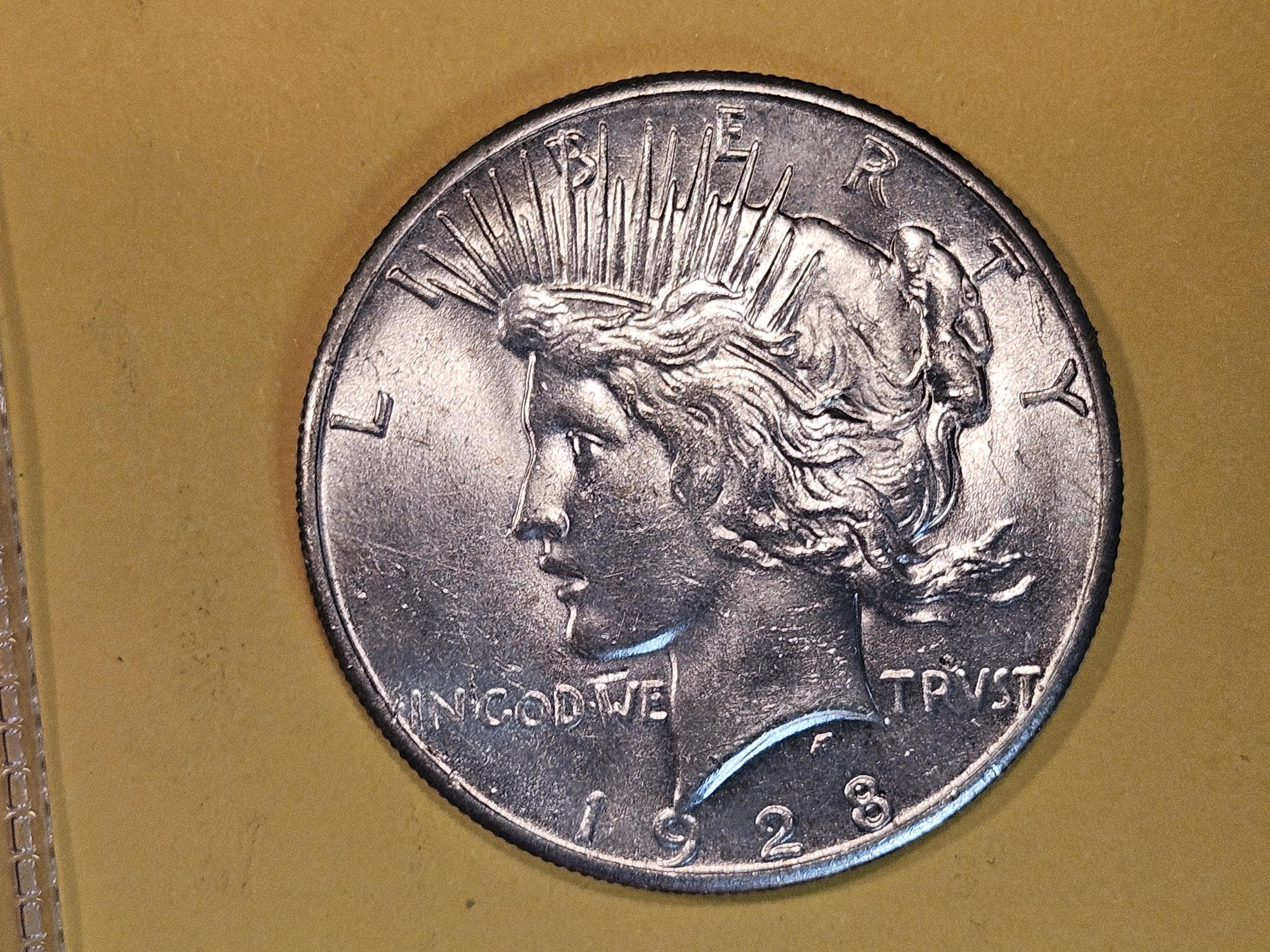** KEY DATE ** 1928 Peace Dollar in Brilliant About Uncirculated - 58!