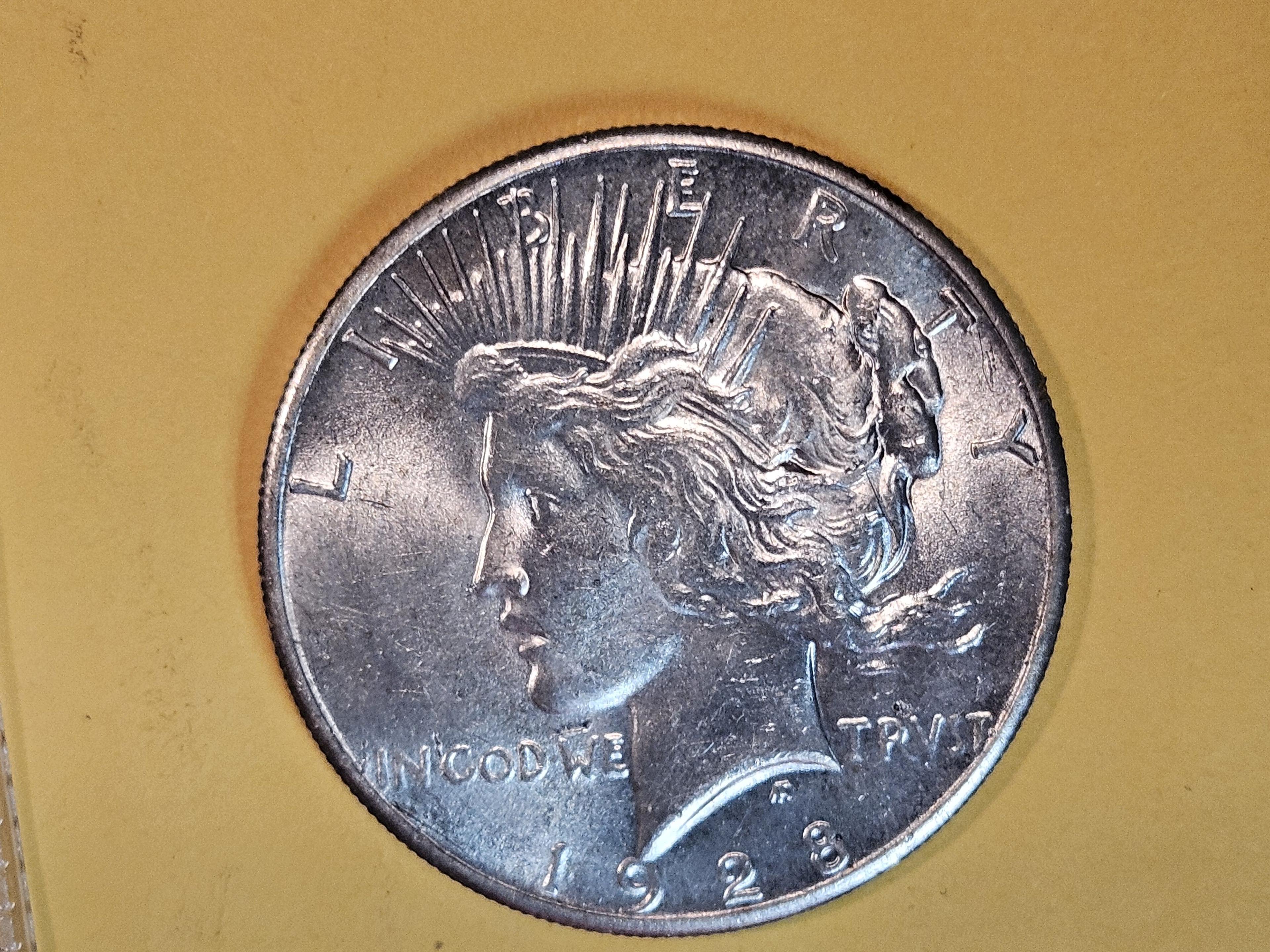 ** KEY DATE ** 1928 Peace Dollar in Brilliant About Uncirculated - 58!