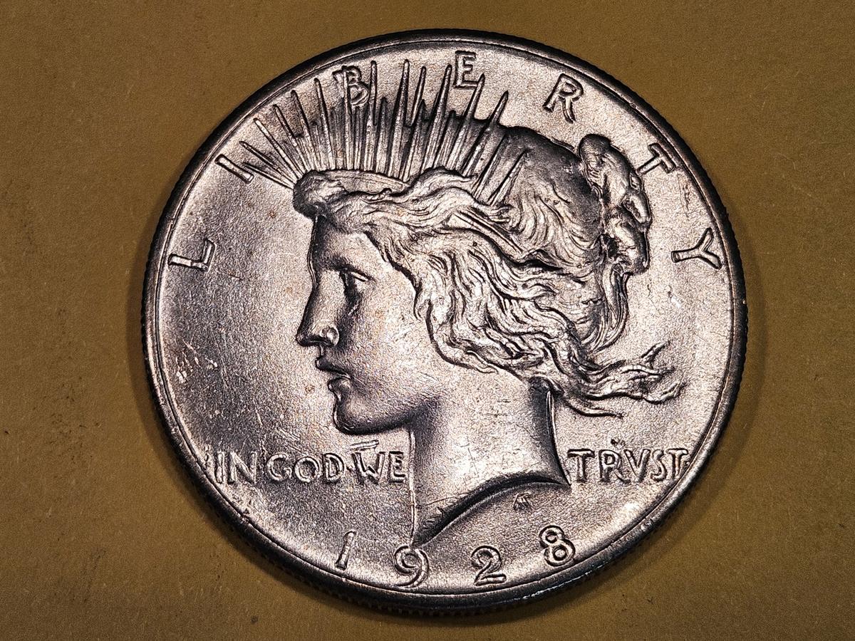 ** KEY DATE ** 1928 Peace Dollar in Brilliant About Uncirculated - 58!