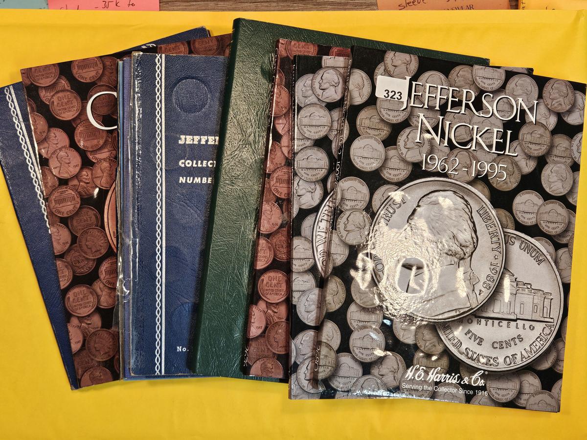 Seven mixed, full and partially full coin albums
