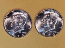 Two Gem Brilliant Uncirculated silver Kennedy half dollars