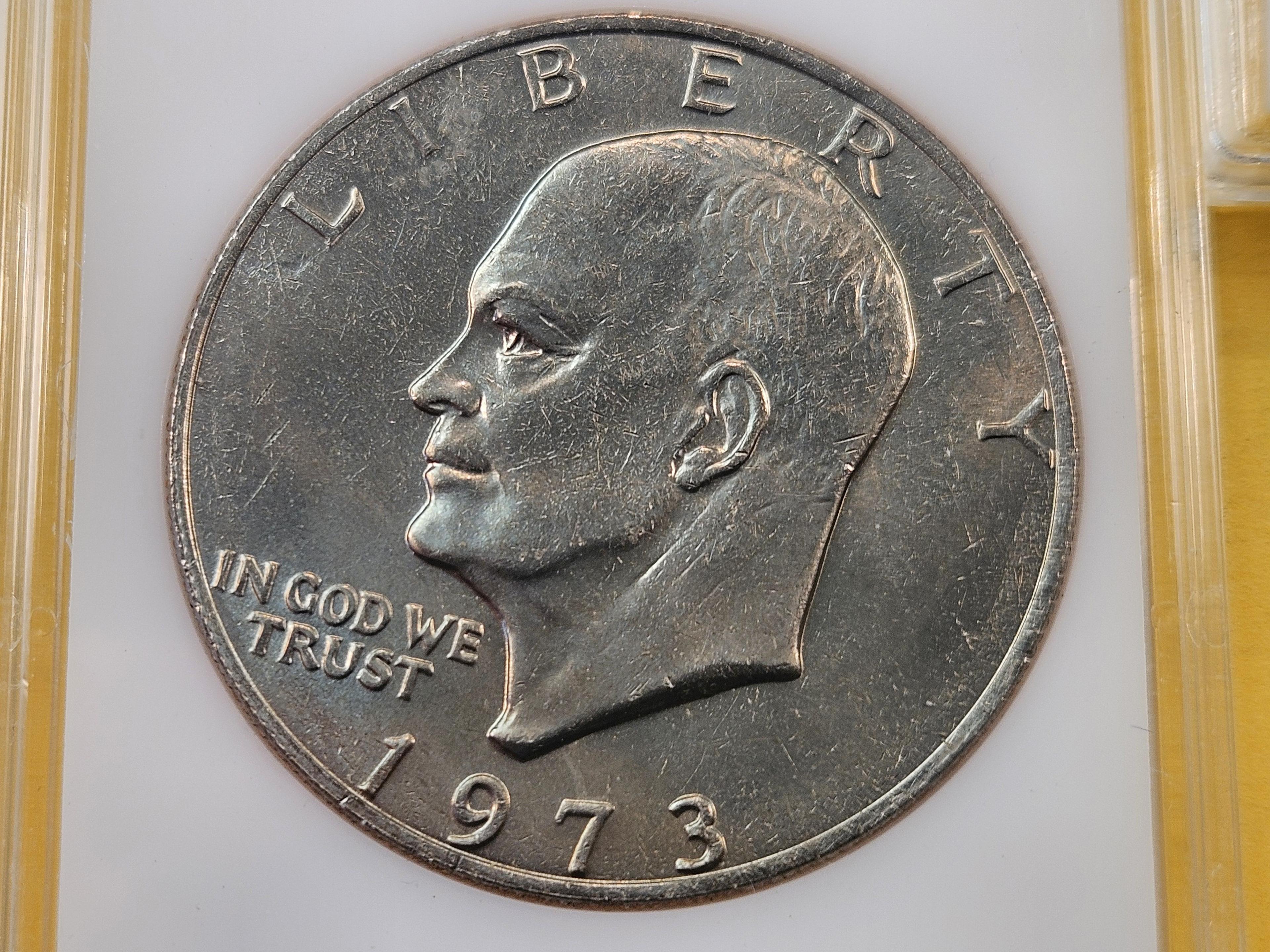 Five Uncirculated Eisenhower Dollars, one Silver