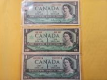 Three Canadian One Dollar Notes