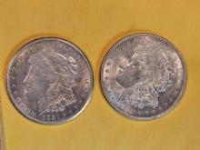 Two Brilliant About Uncirculated plus Morgan Silver Dollars